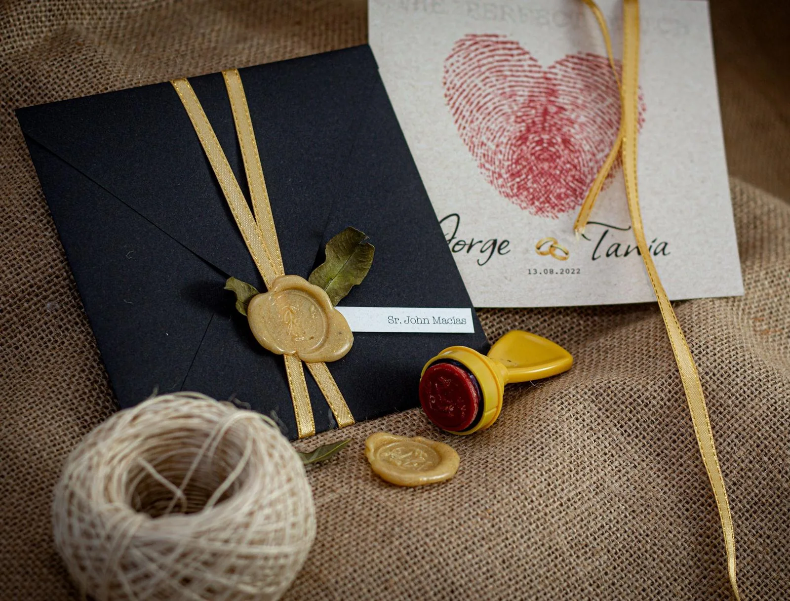 Sealed wedding invitation envelope with a guest name printed on a small label