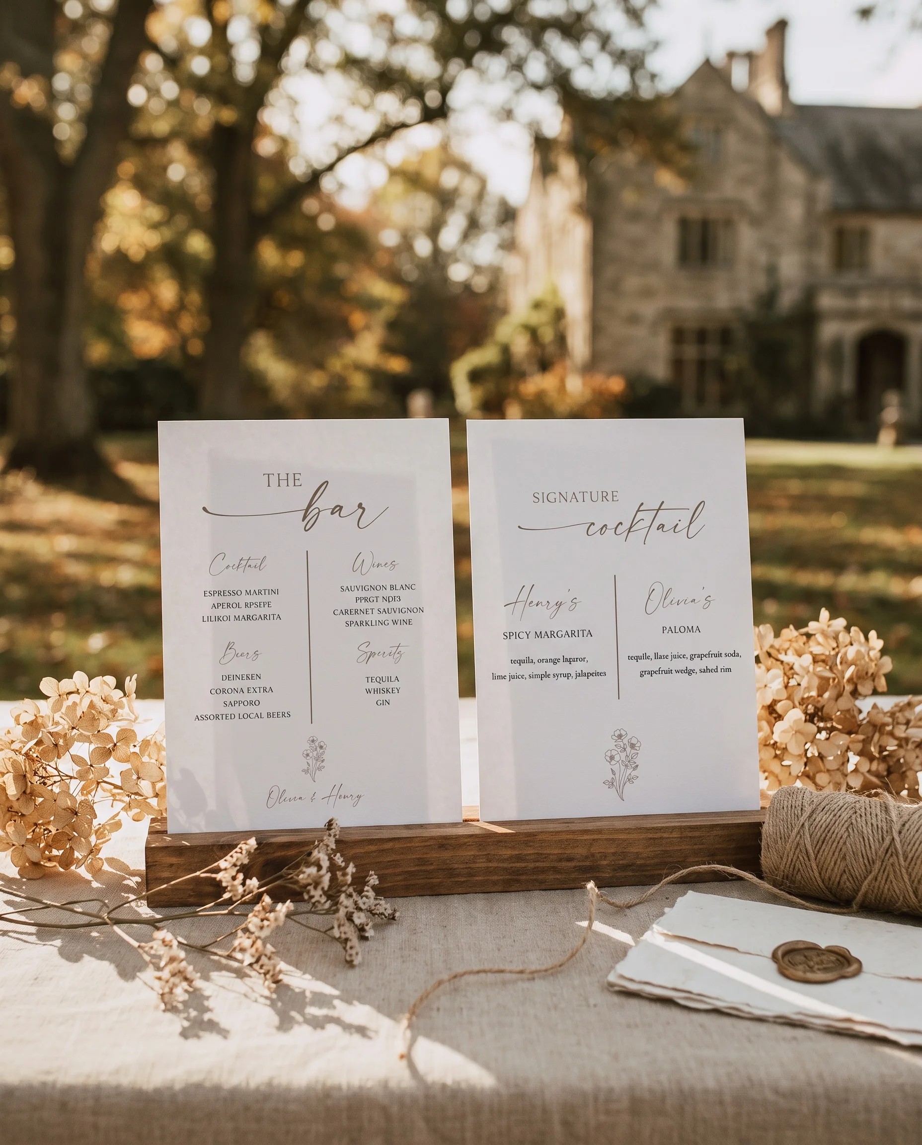 Anemora — bar menu with two pages displayed upright in a styled setting under soft natural light, wedding bar sign