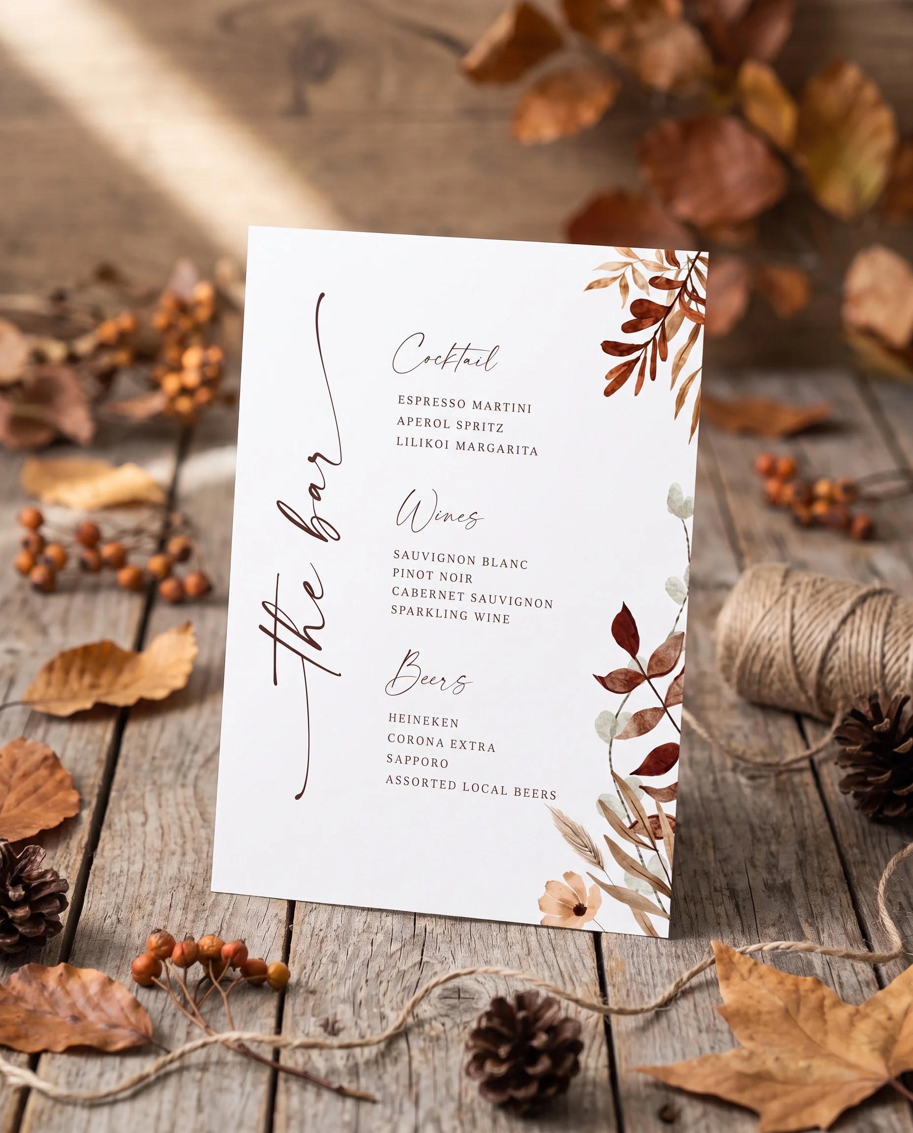 Autumn Bower — bar menu displayed upright in a styled setting under soft natural light at a slight overhead angle, wedding bar sign.