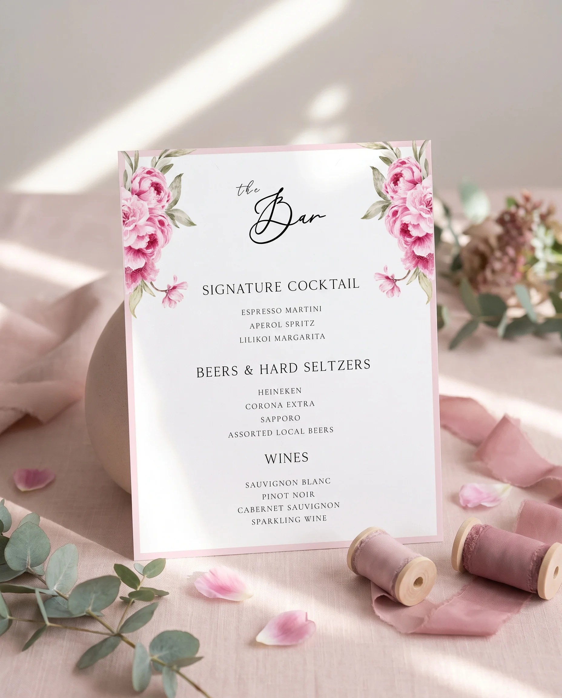 Blush Peony — bar menu page displayed upright in a styled setting with soft natural light, wedding bar sign.