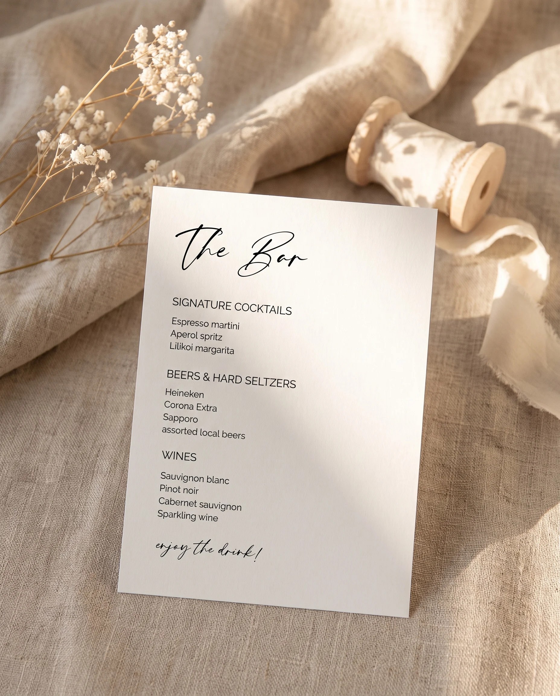 Cathedral — bar menu displayed upright in a styled setting under soft natural light at a slight overhead angle, wedding bar sign.