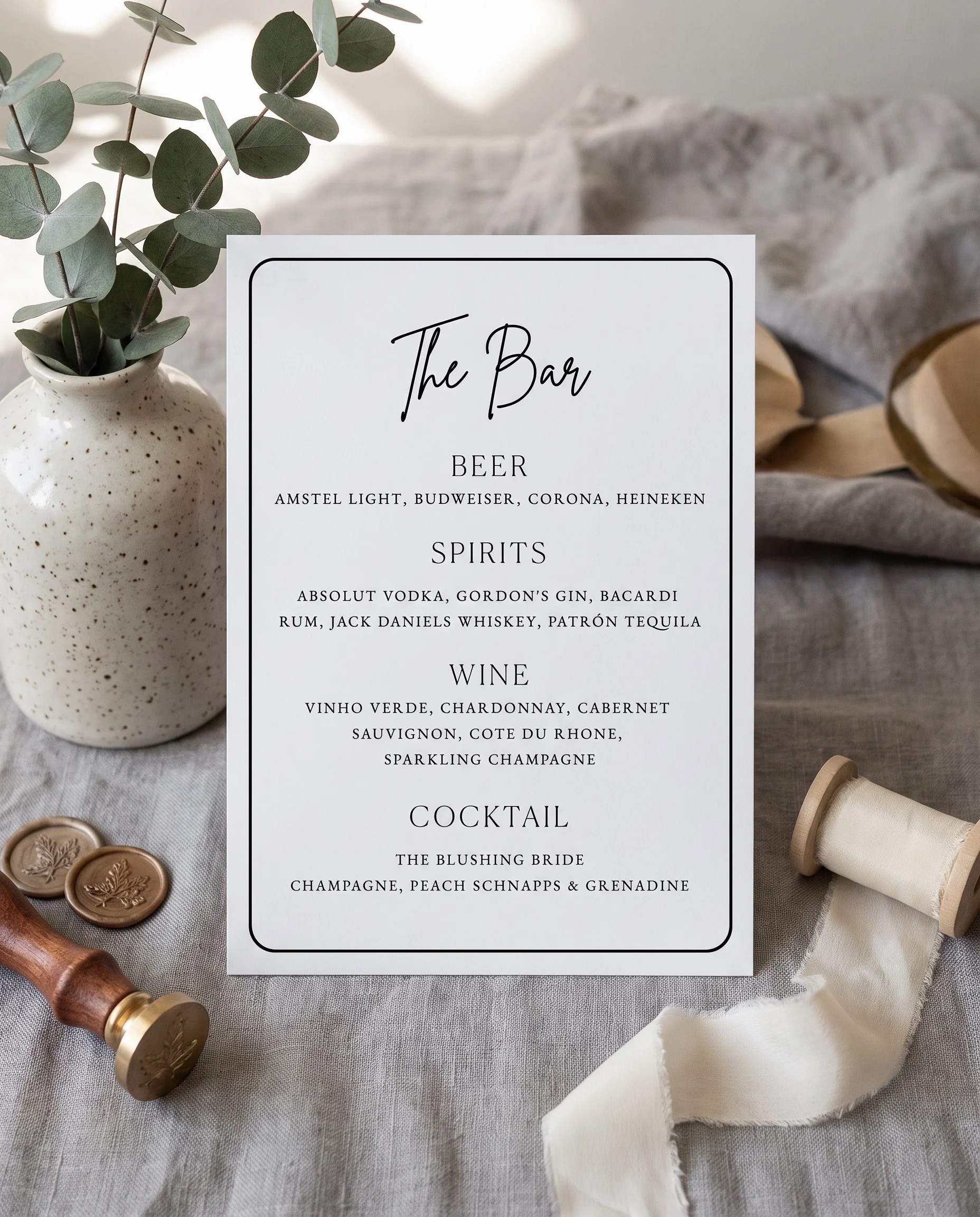 Contour — Bar Menu displayed upright in a styled setting under soft natural light with a slight overhead angle, wedding bar sign.