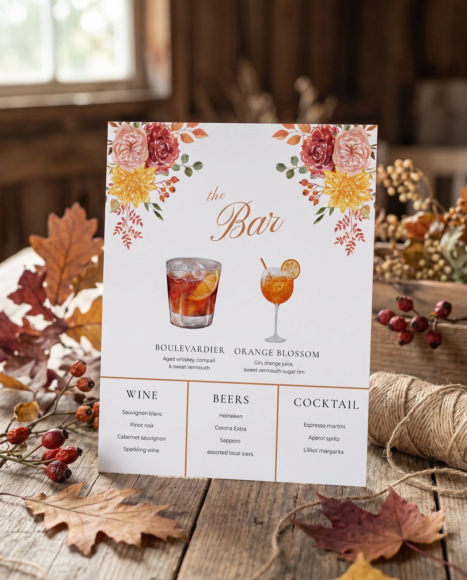 Ember Bloom — bar menu page displayed upright in a styled setting under soft natural light, wedding bar sign.