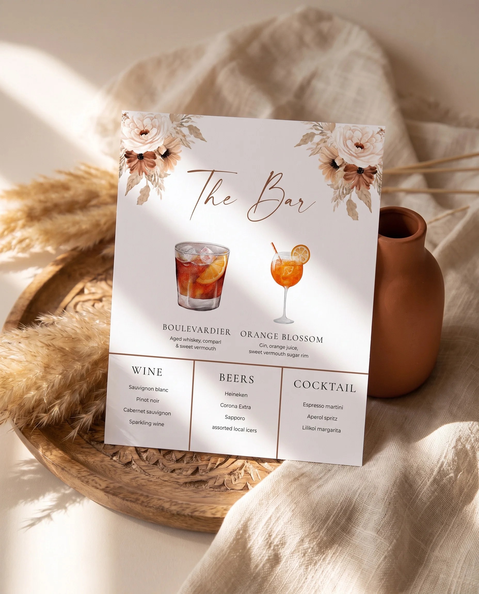 Pampas Bloom — bar menu page displayed upright in a styled setting under soft natural light, wedding bar sign