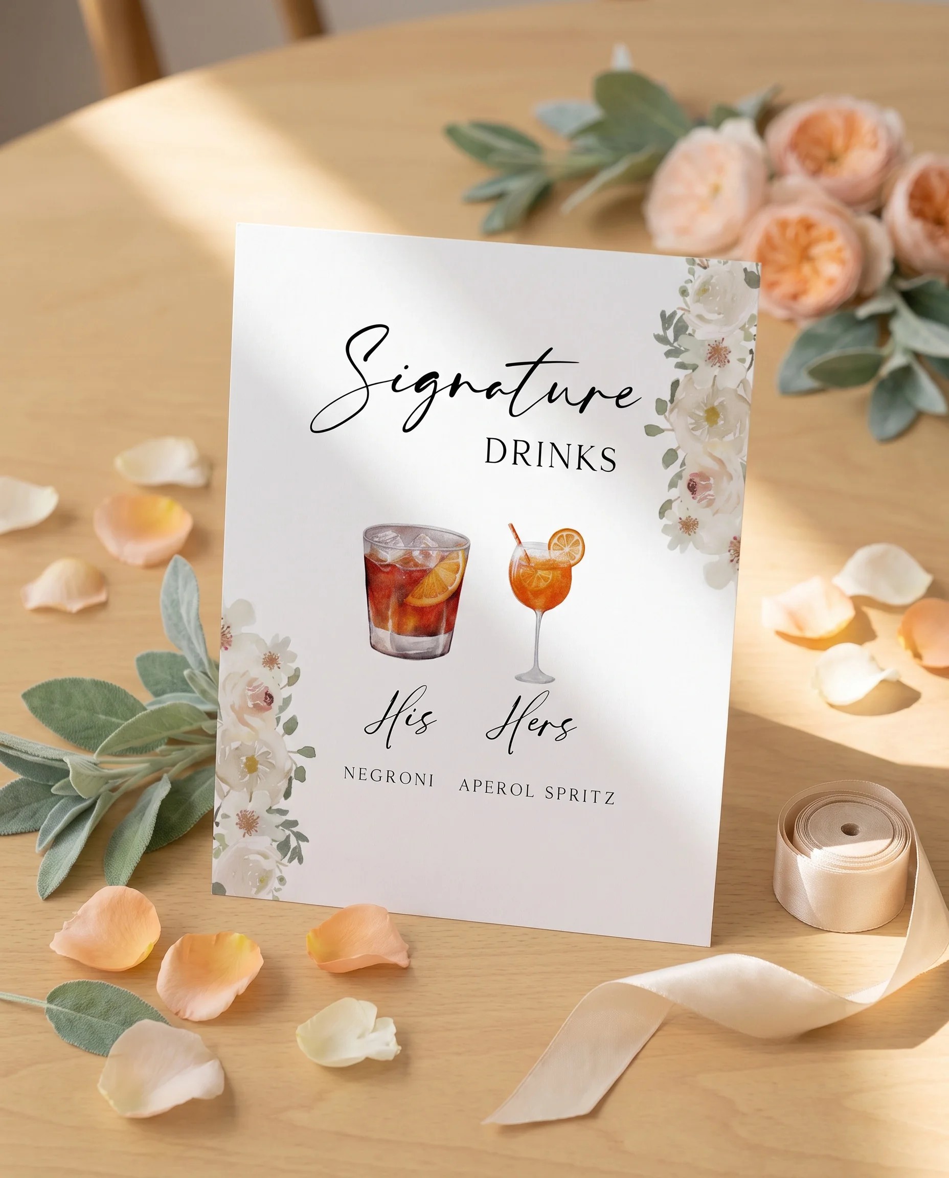 Seraphine — bar menu page displayed upright under soft natural light at a slight overhead angle, wedding bar sign.