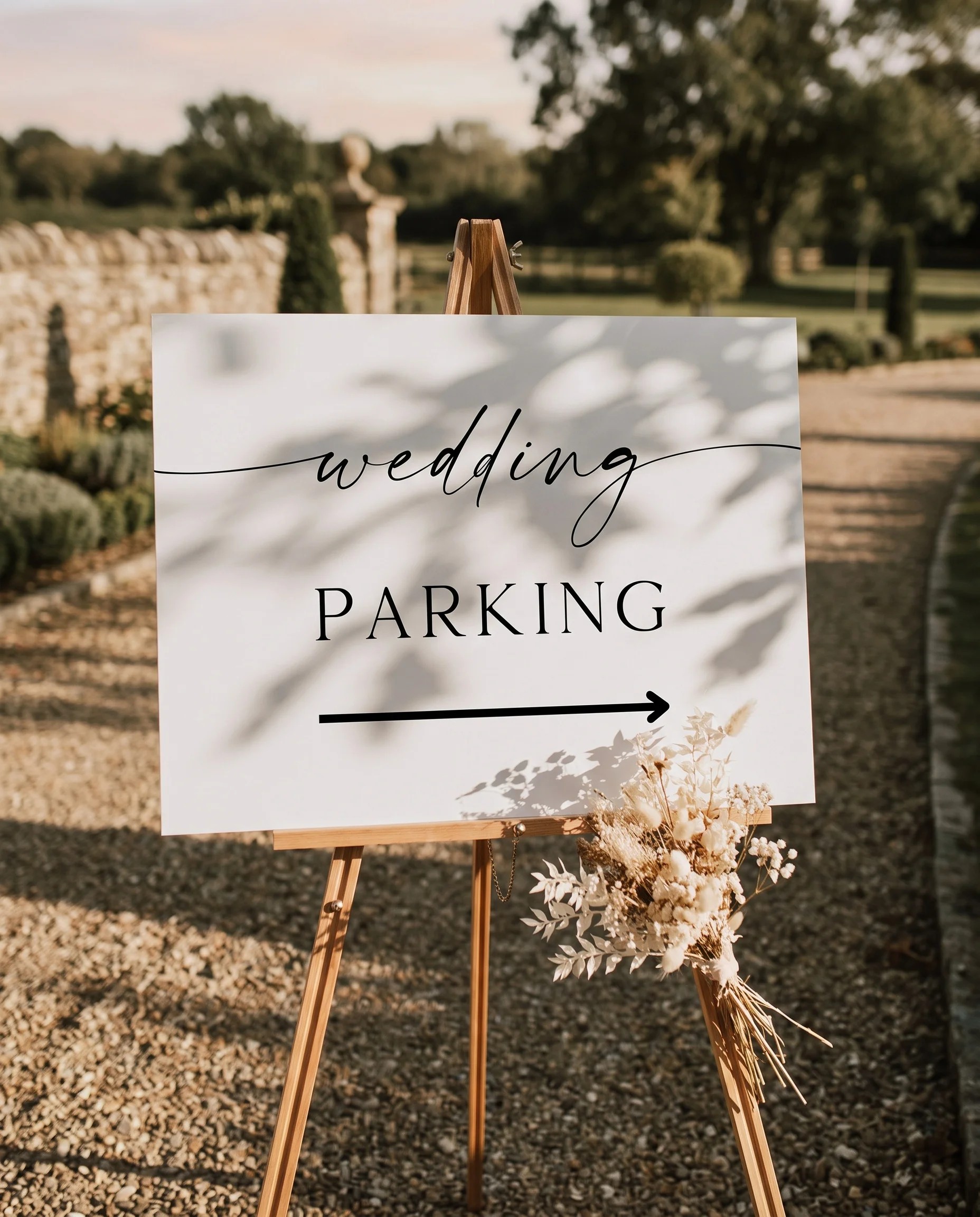 Sunlit wedding parking sign — displayed at a venue entrance under soft natural light with a slight overhead angle, wedding signs.