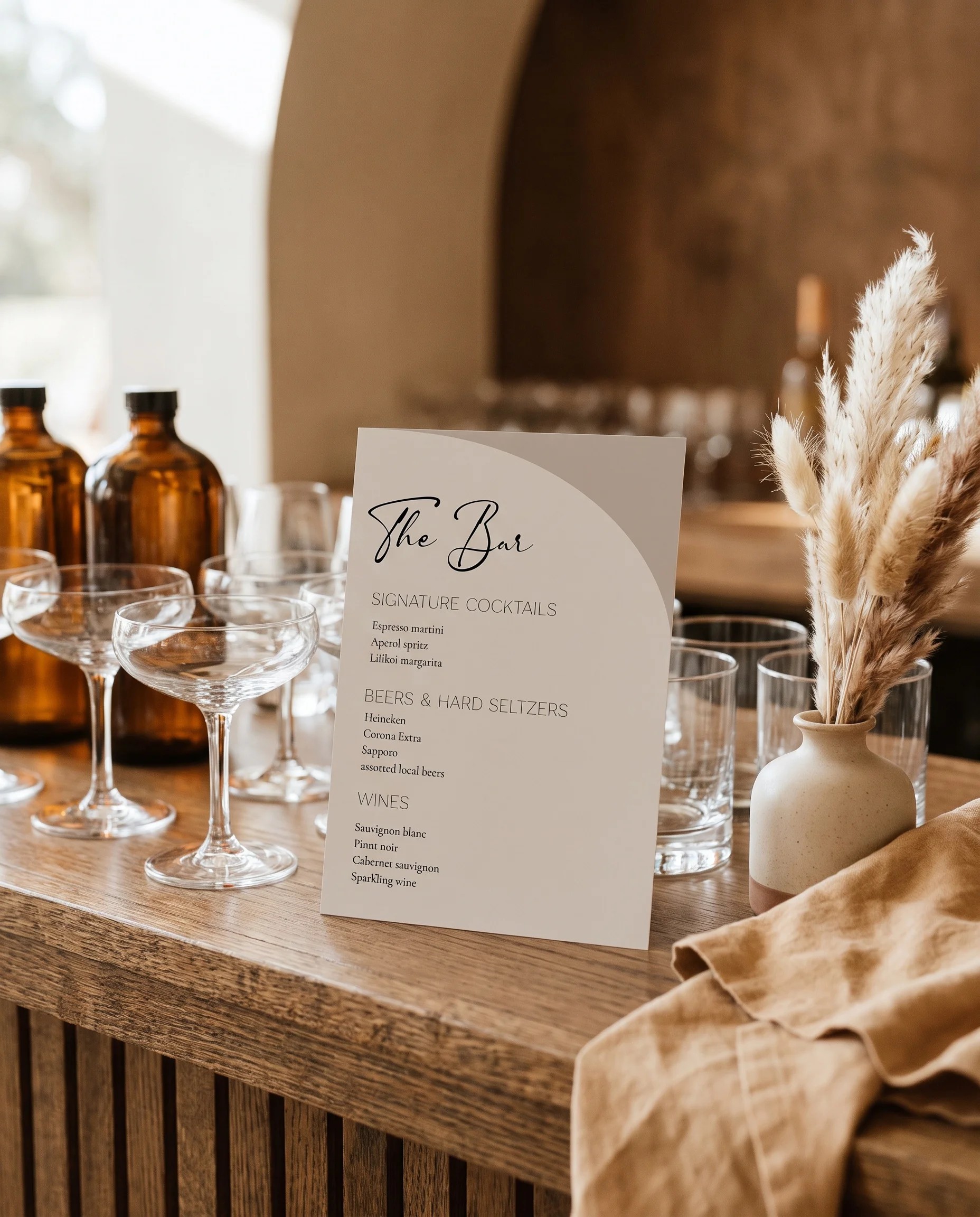 Tassel Arc — bar menu page displayed on a drinks station under soft natural light, bar menu template.
