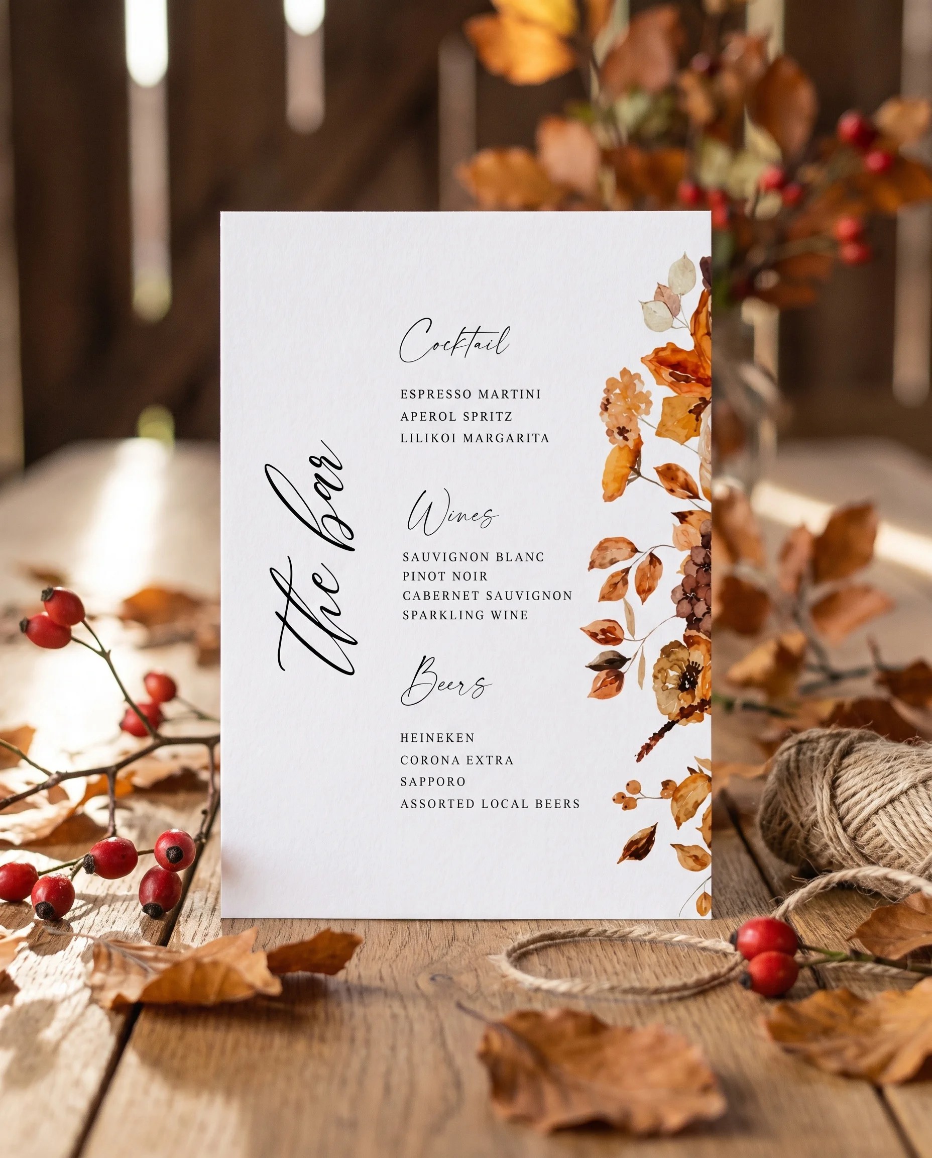 Autumn Bramble — bar menu page displayed upright in a styled setting under soft natural light, wedding bar sign.