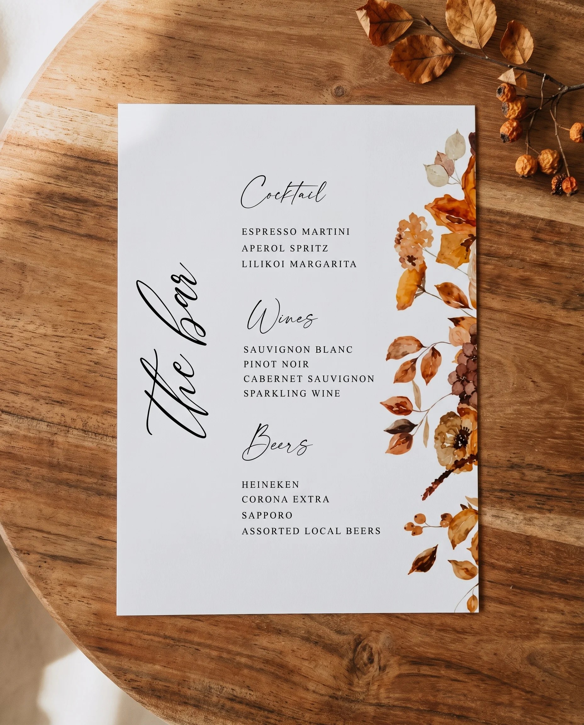 Autumn Bramble — single page shown flat on premium editorial paper under soft natural light from a slight overhead angle, wedding bar menu.