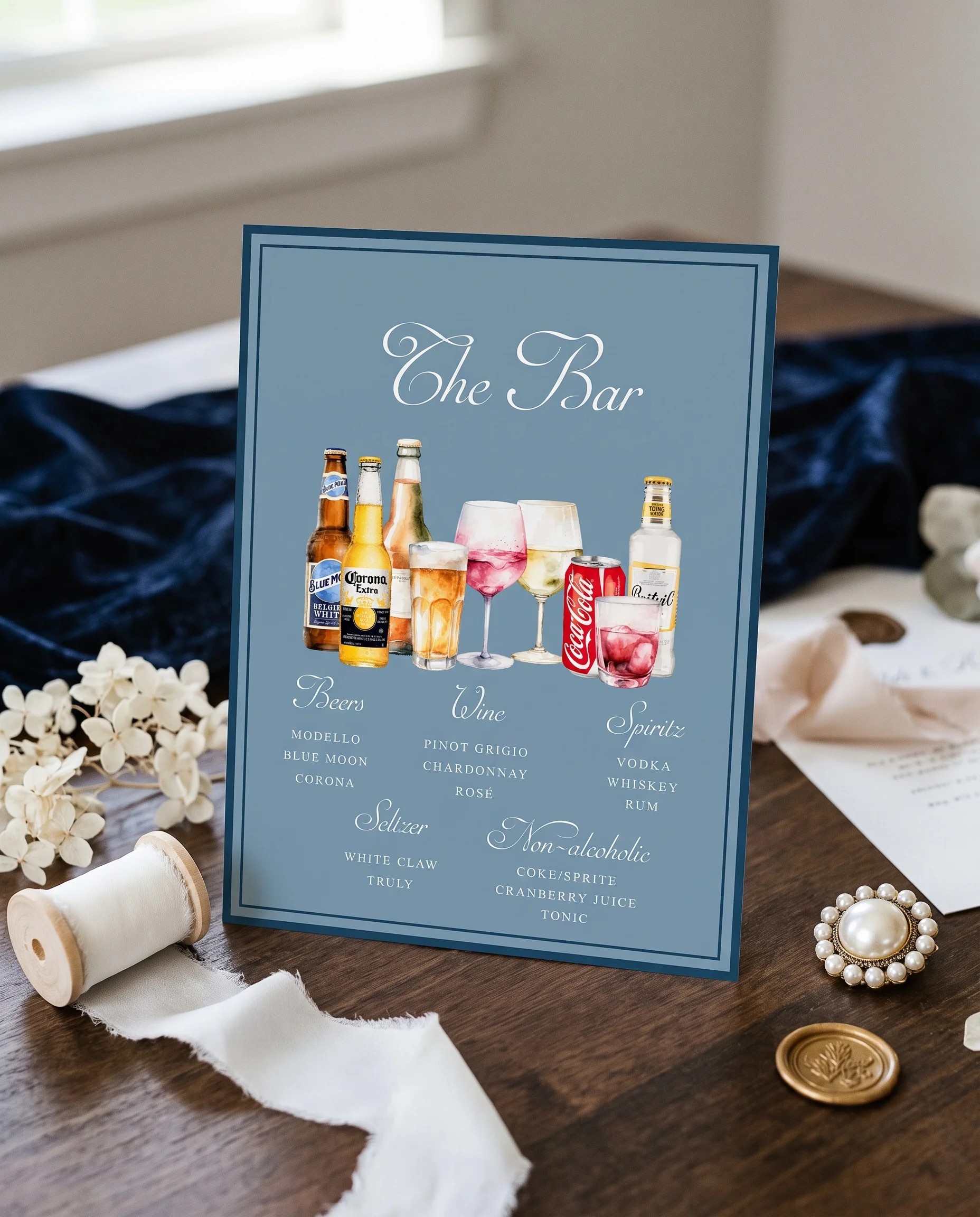 Windsor Crown — bar menu page displayed upright in a styled setting under soft natural light, wedding bar sign.