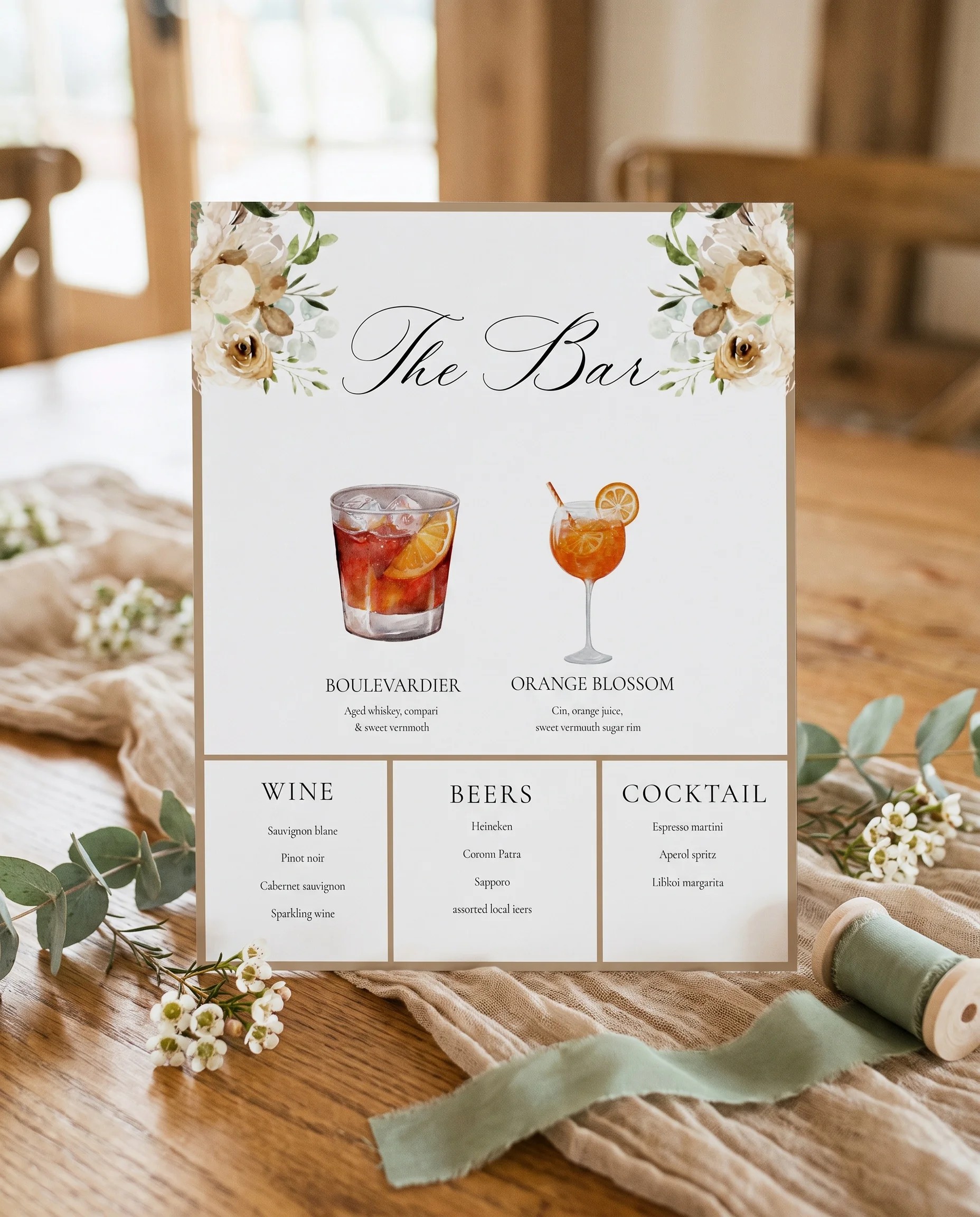 Meadow Veil — bar menu displayed upright on premium editorial paper under soft natural light at a slight overhead angle, wedding bar sign.