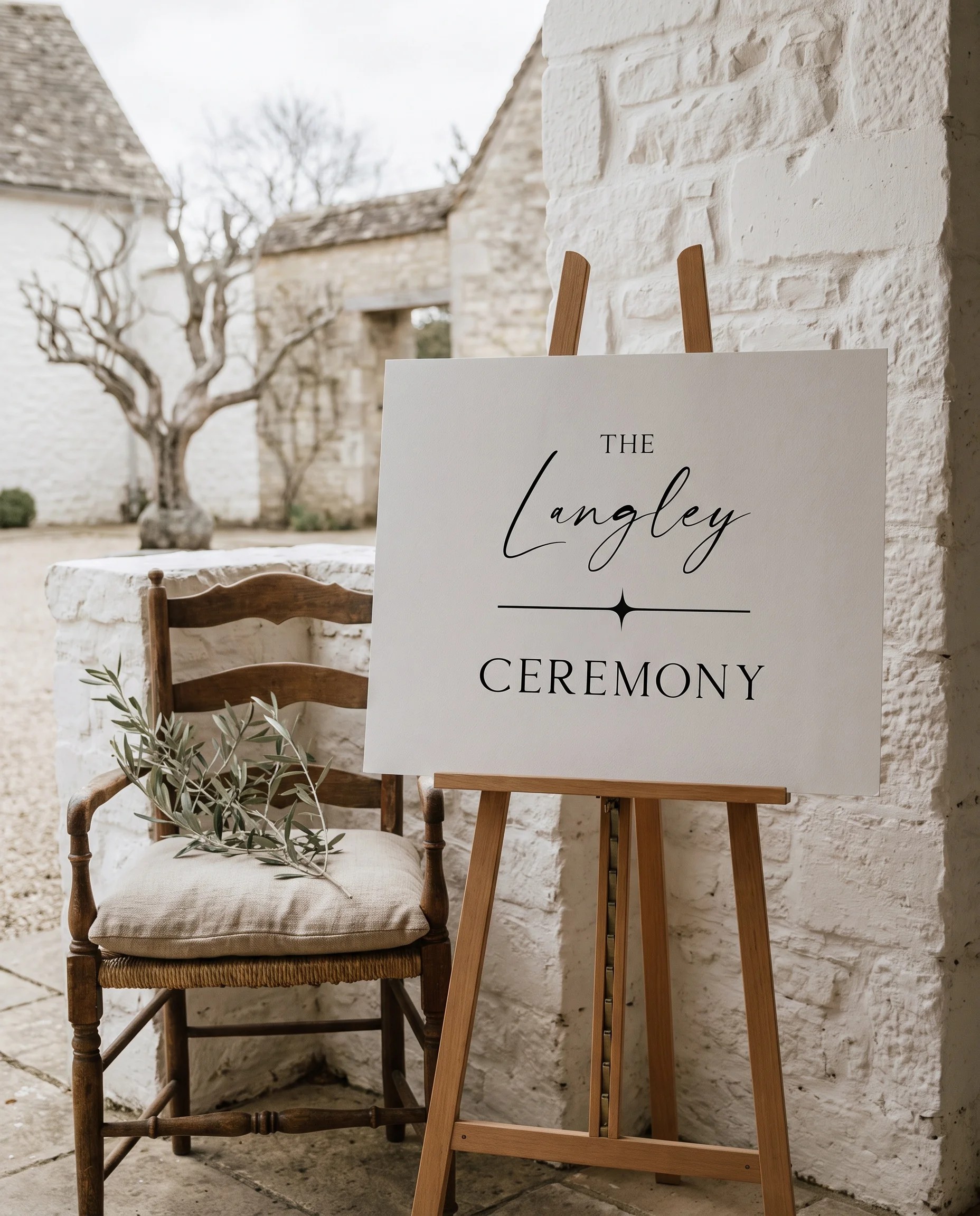 Liminal wedding ceremony sign — displayed beside furniture for scale under soft natural light, wedding signage.
