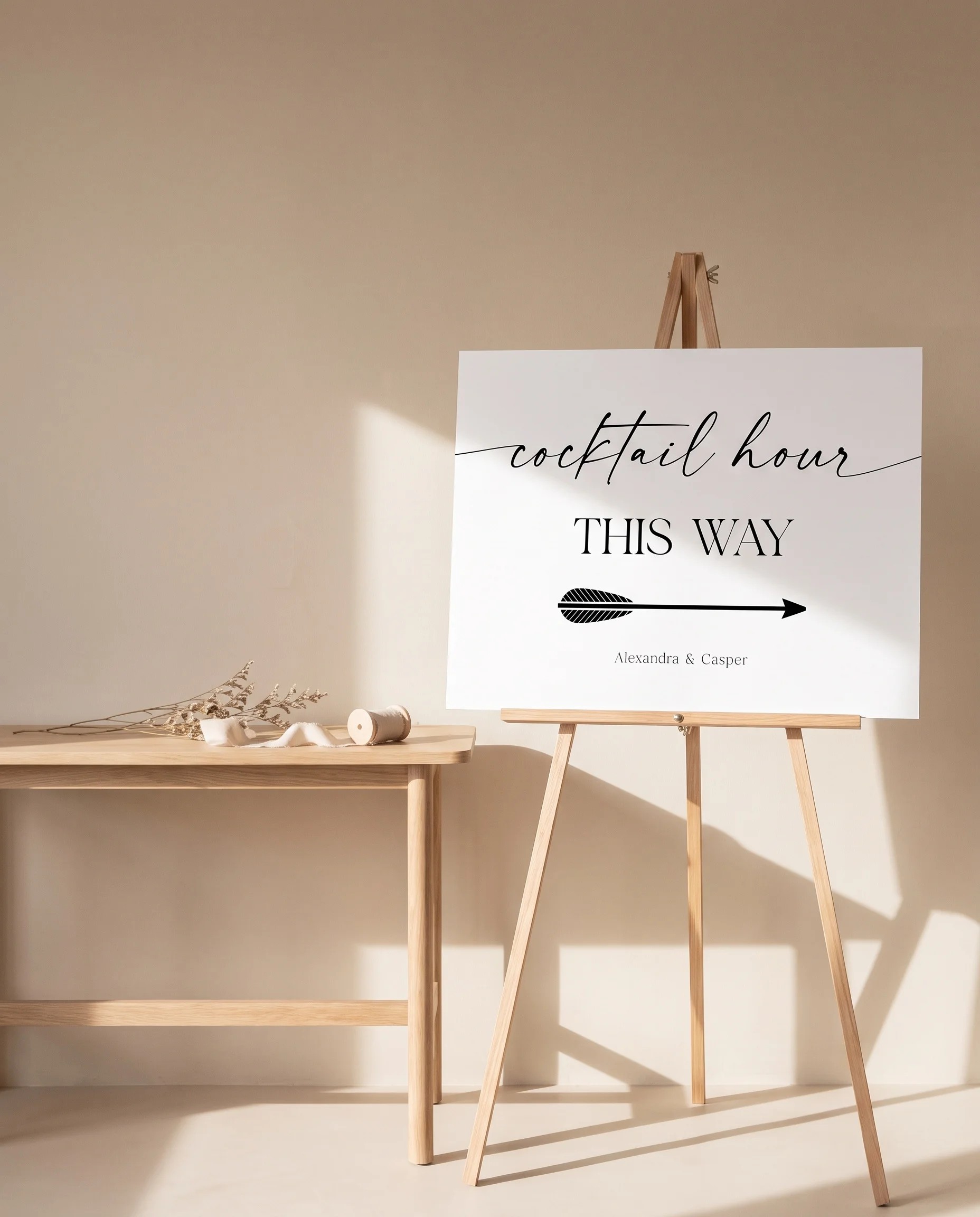 Charline wedding cocktail hour sign — shown beside furniture for scale on premium editorial paper under soft natural light, wedding signage.