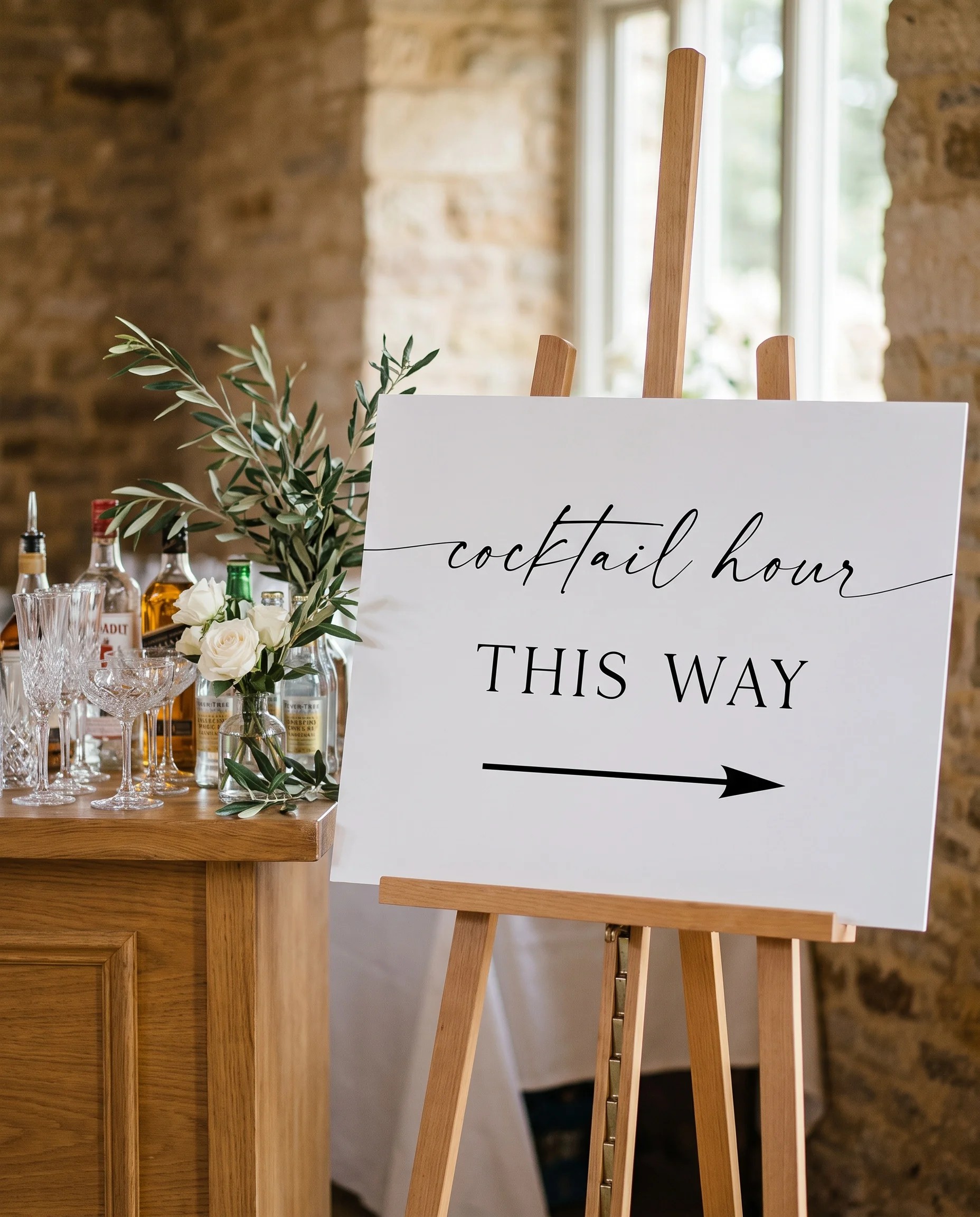 Liminal wedding cocktail hour sign — displayed beside a drinks station on premium editorial paper under soft natural light, cocktail hour sign.