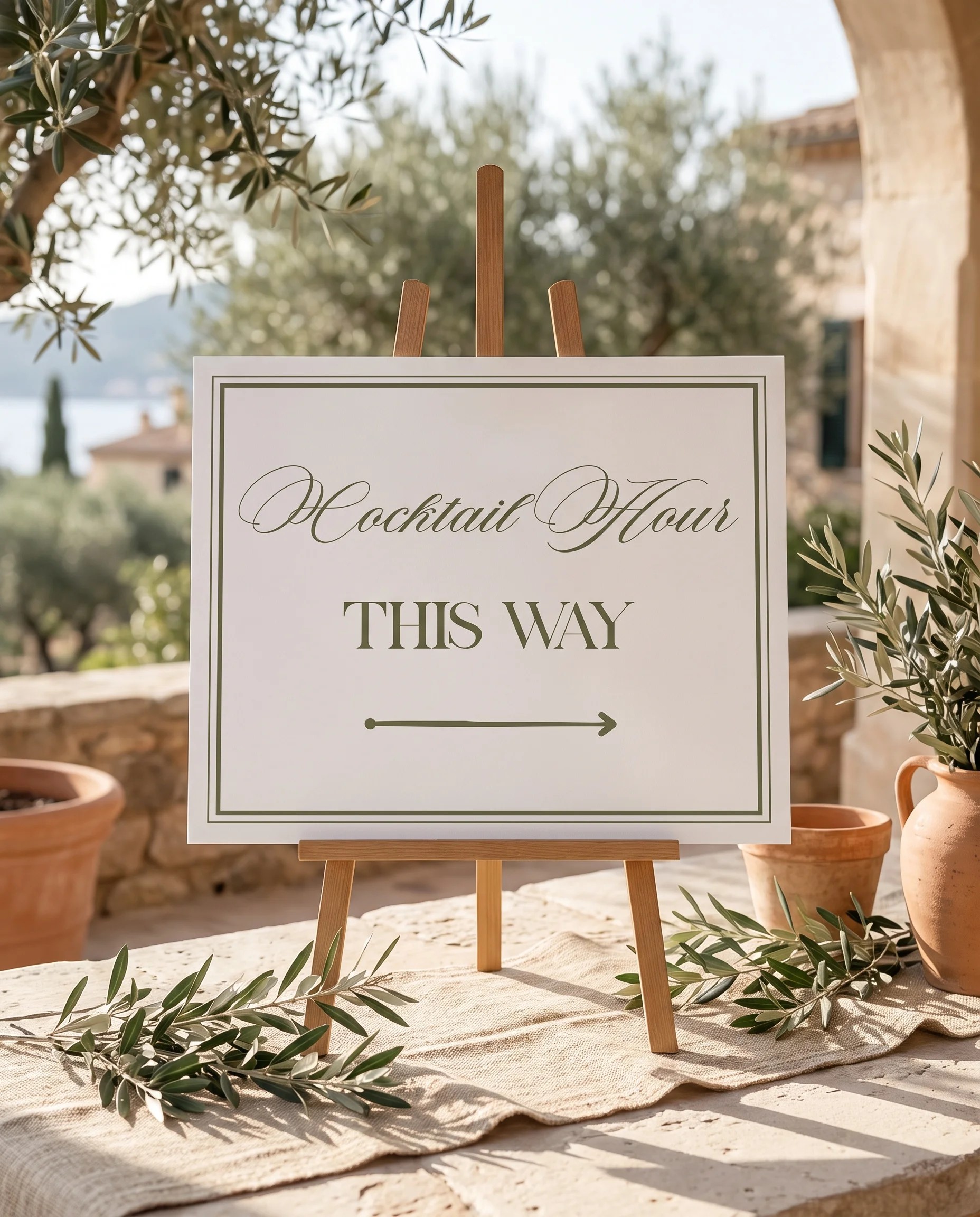 Olive Script wedding cocktail hour sign — displayed on an easel under soft natural light at a slight overhead angle, wedding signs