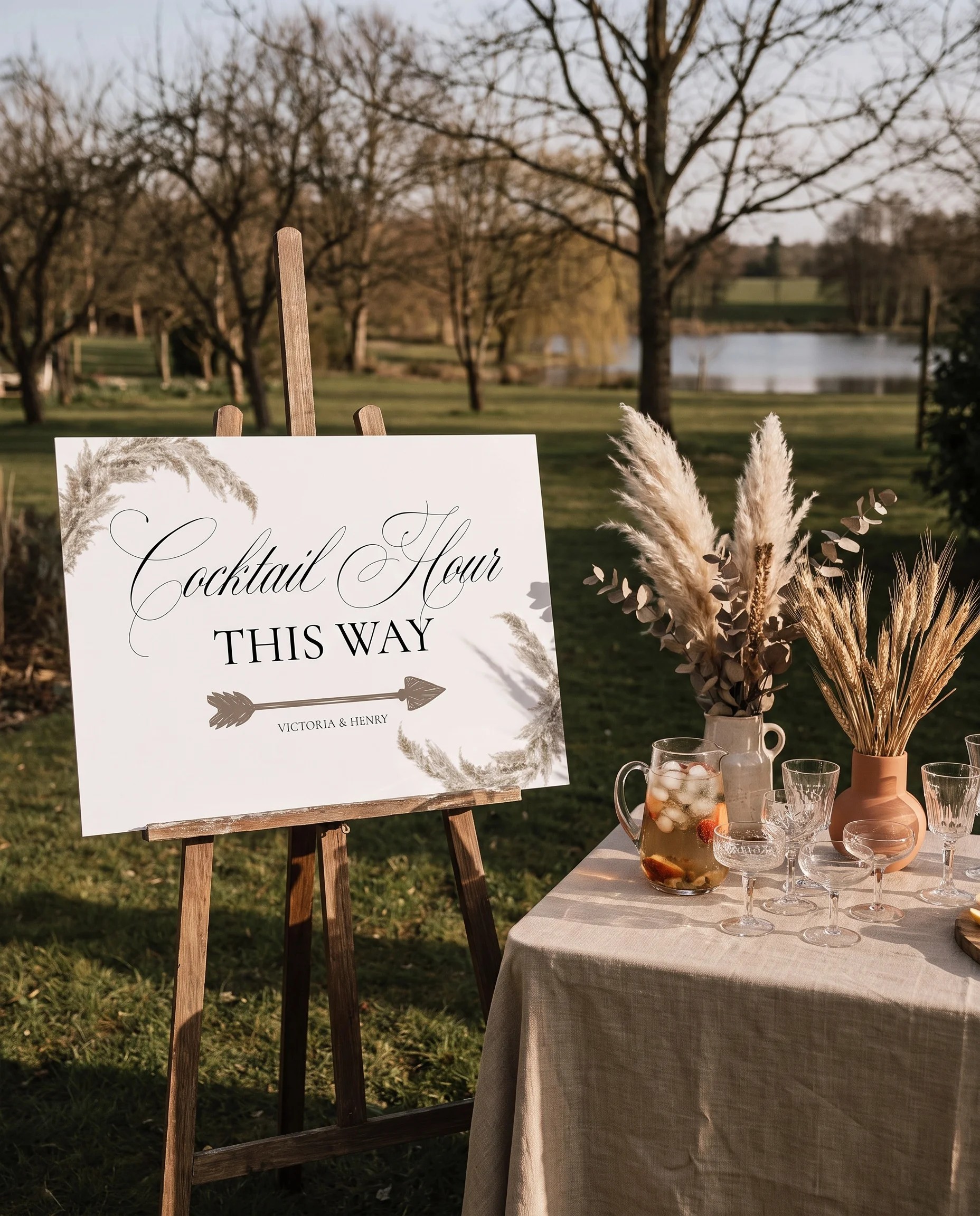 Pampas wedding cocktail hour sign — shown beside a drinks station under soft natural light, cocktail hour sign