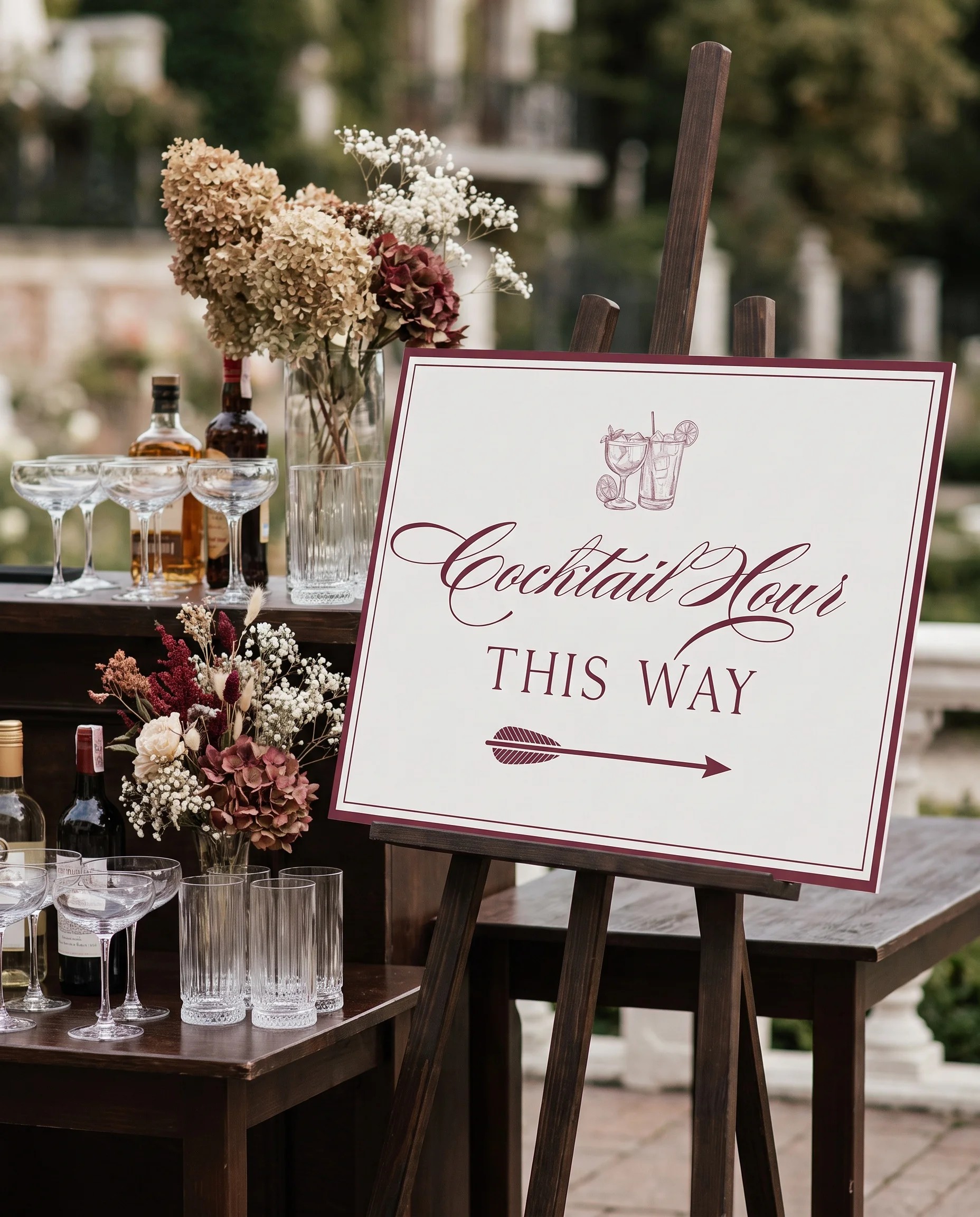 Claret Filigree wedding cocktail hour sign — shown beside a drinks station on premium paper in soft natural light, cocktail hour sign.