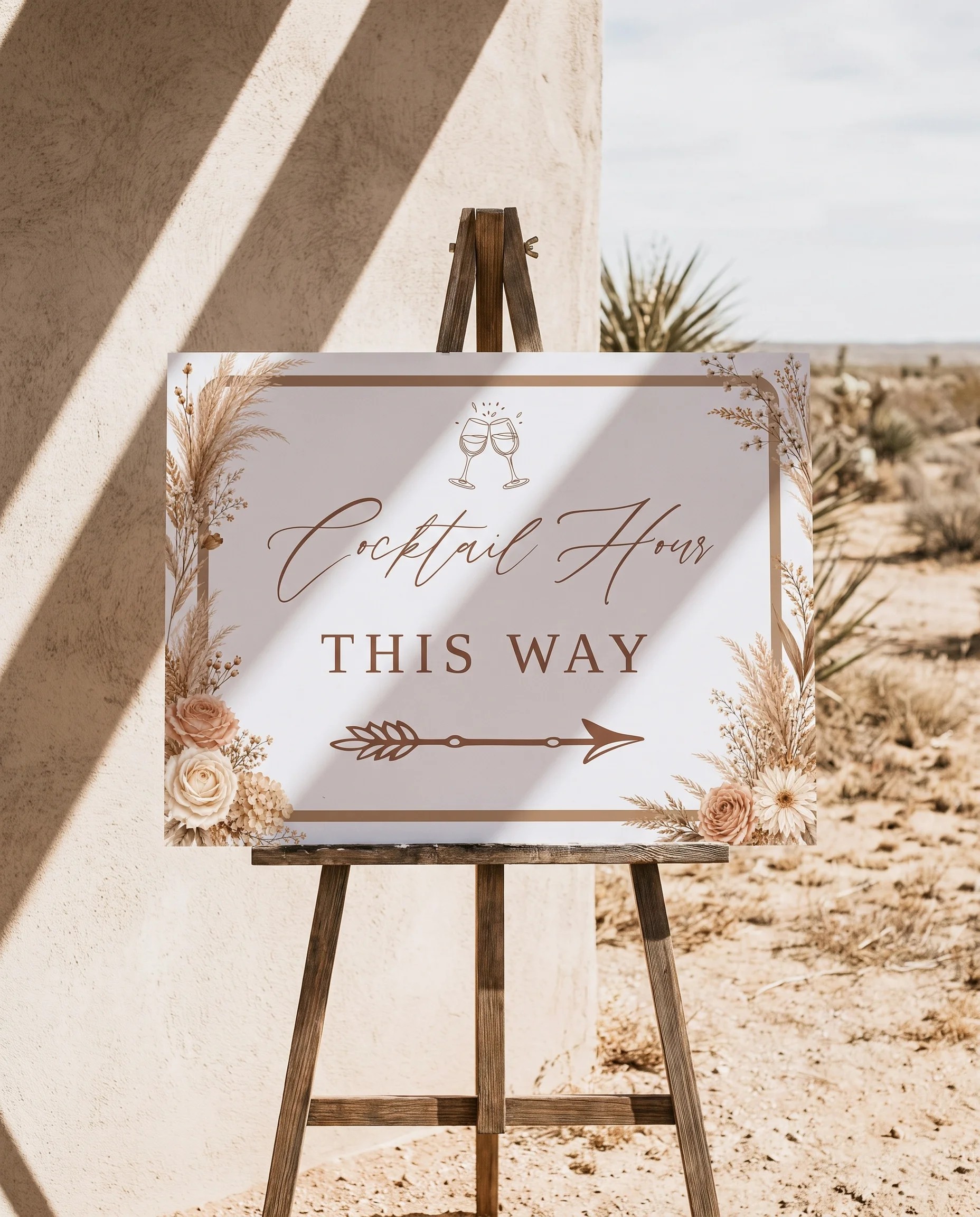 Pampas Hush wedding cocktail hour sign — displayed on an easel under soft natural light at a slight overhead angle, wedding signs
