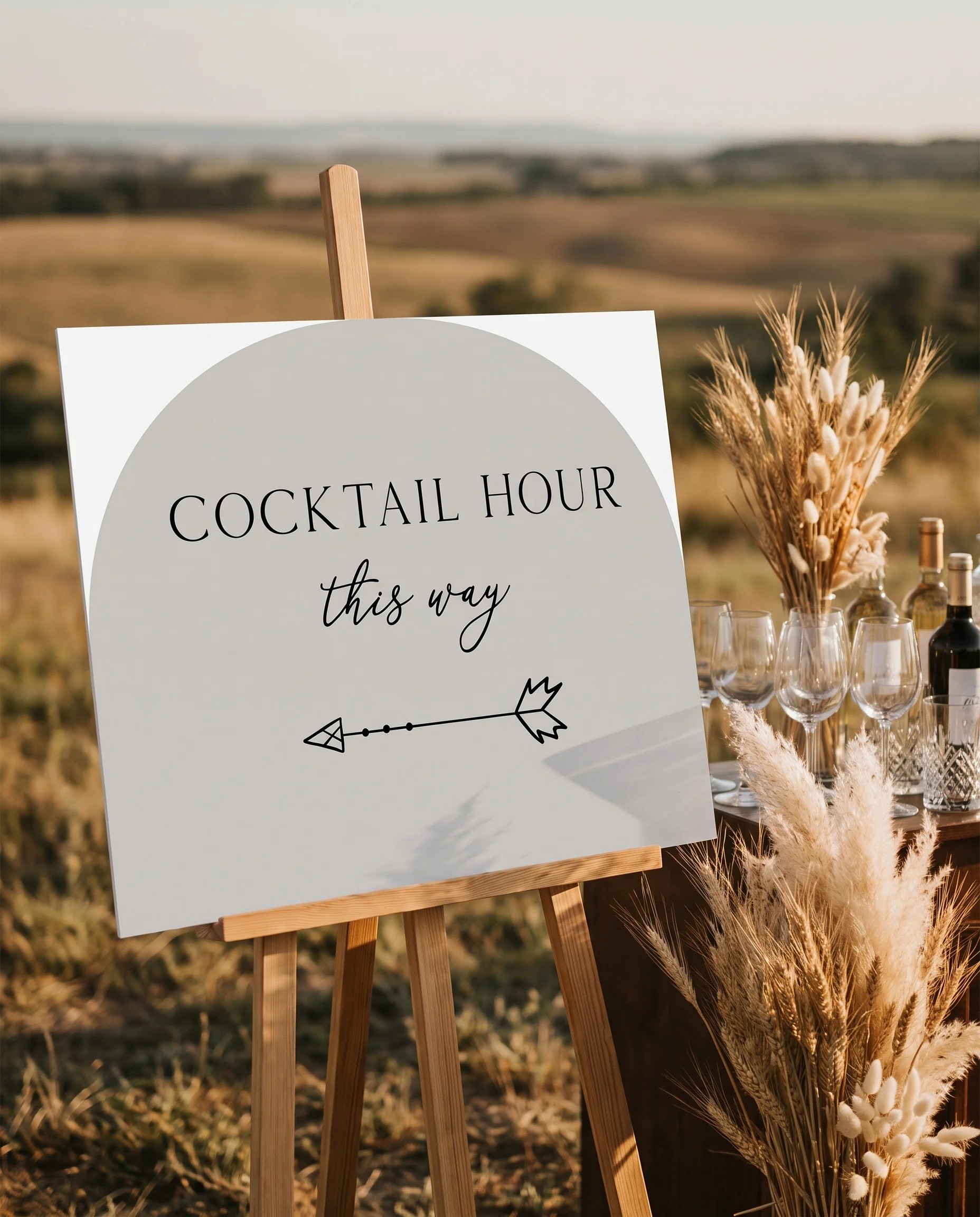 Halo Arch wedding cocktail hour sign — displayed beside a drinks station on premium editorial paper under soft natural light, cocktail hour sign.