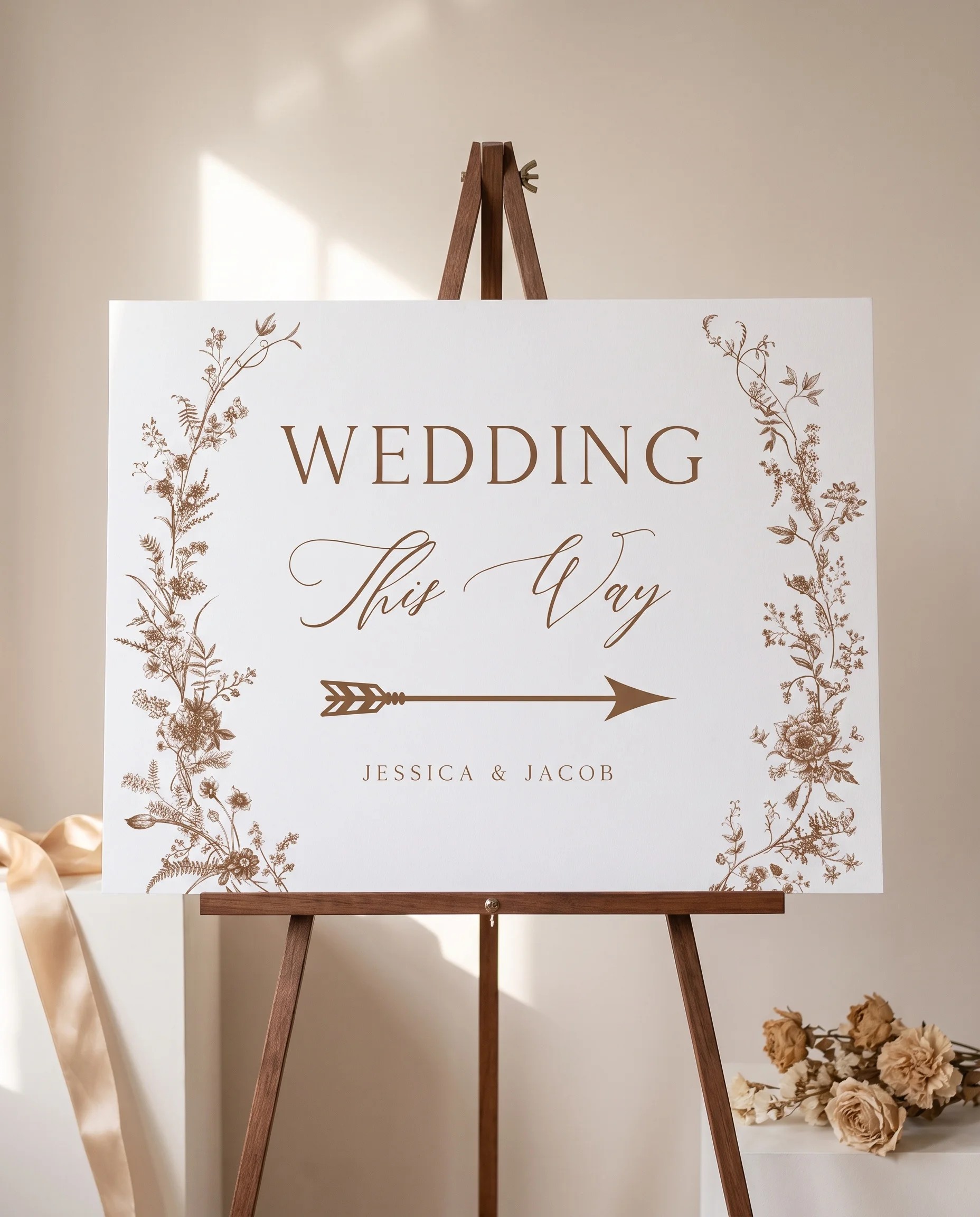 Sepia Crest wedding directional sign — displayed on an easel under soft natural light at a slight overhead angle, wedding signs.
