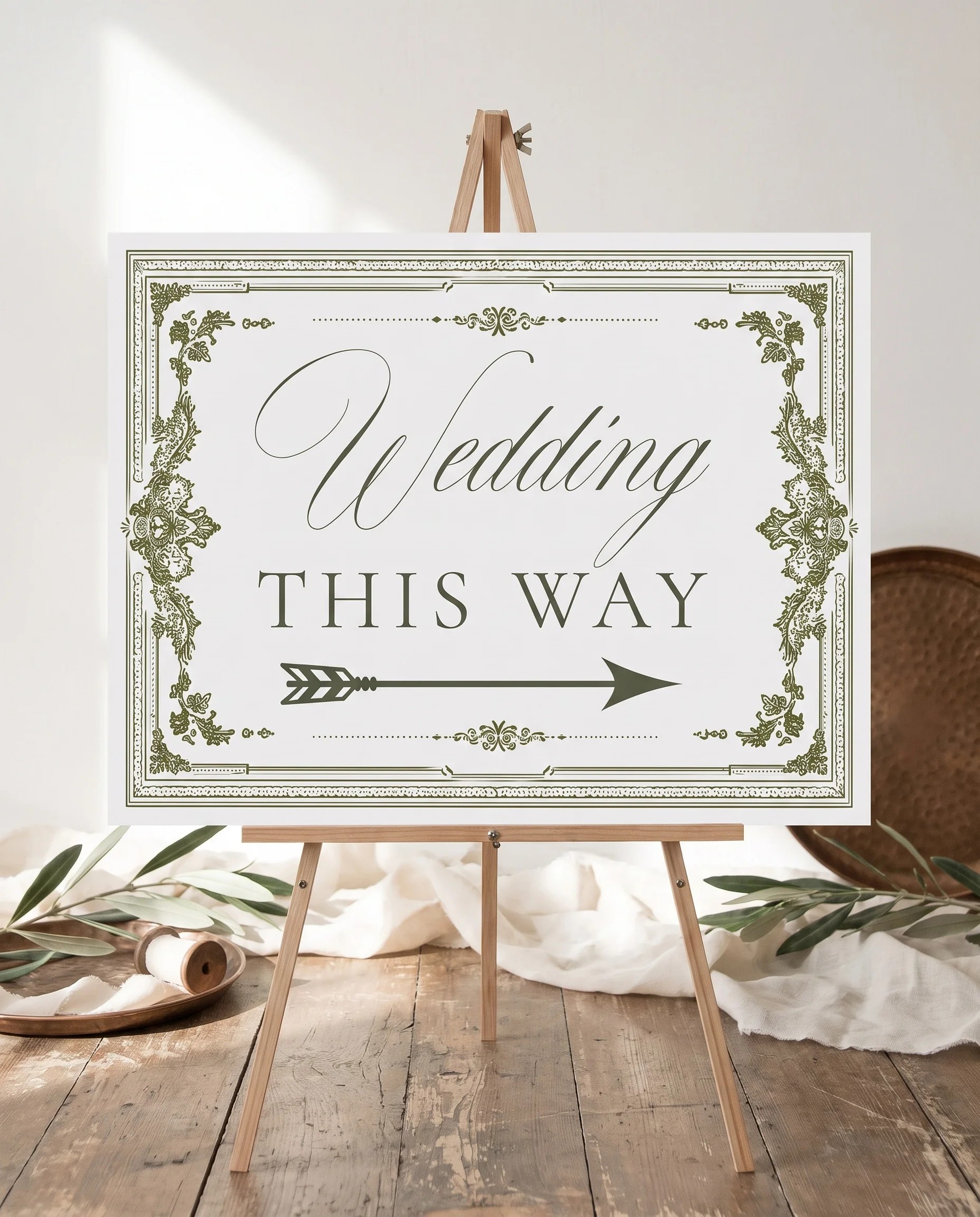 Verdant Filigree wedding directional sign — displayed on an easel under soft natural light at a slight overhead angle, wedding signs