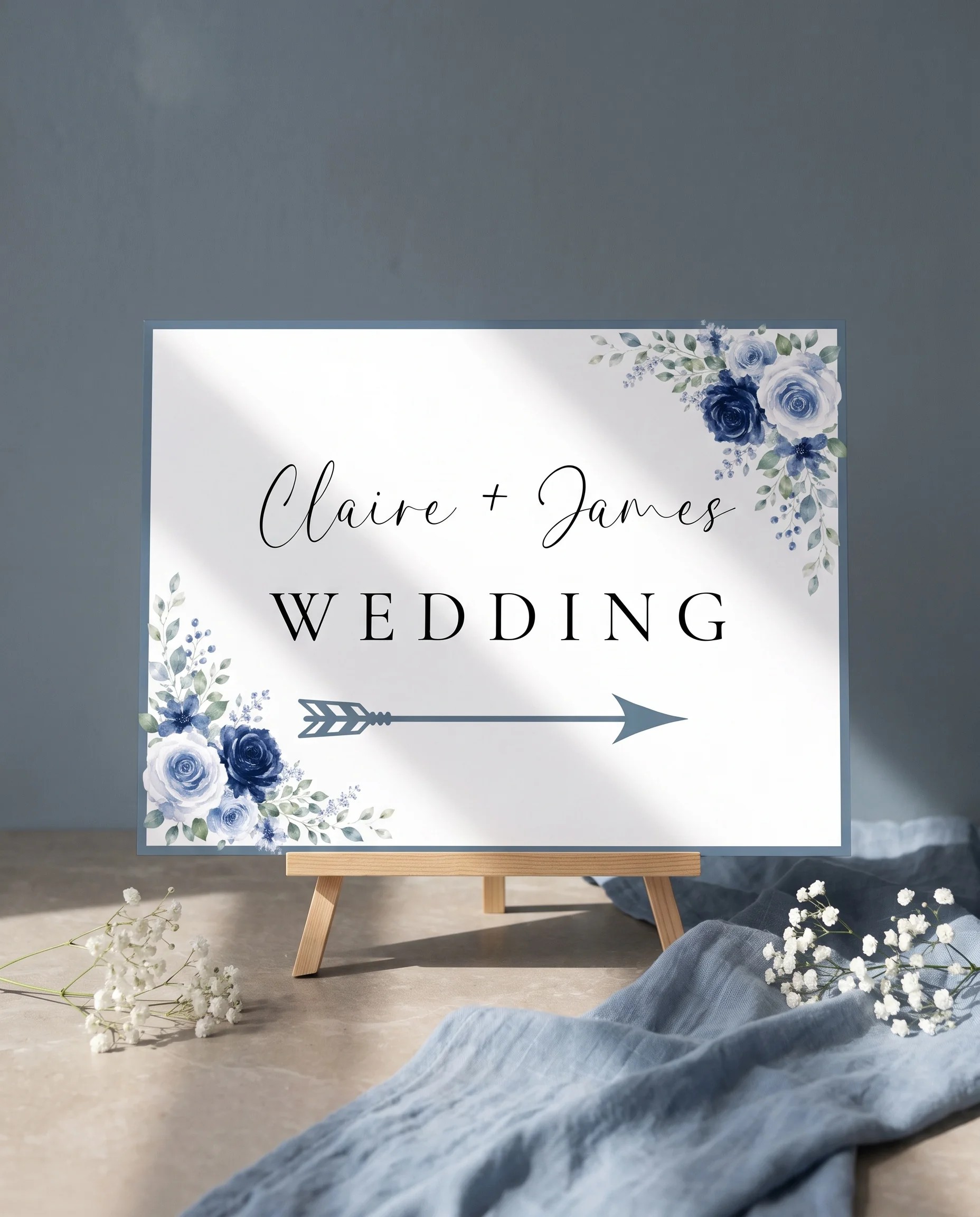Bluebloom wedding directional sign — displayed on an easel under soft natural light with a slight overhead angle, wedding signs