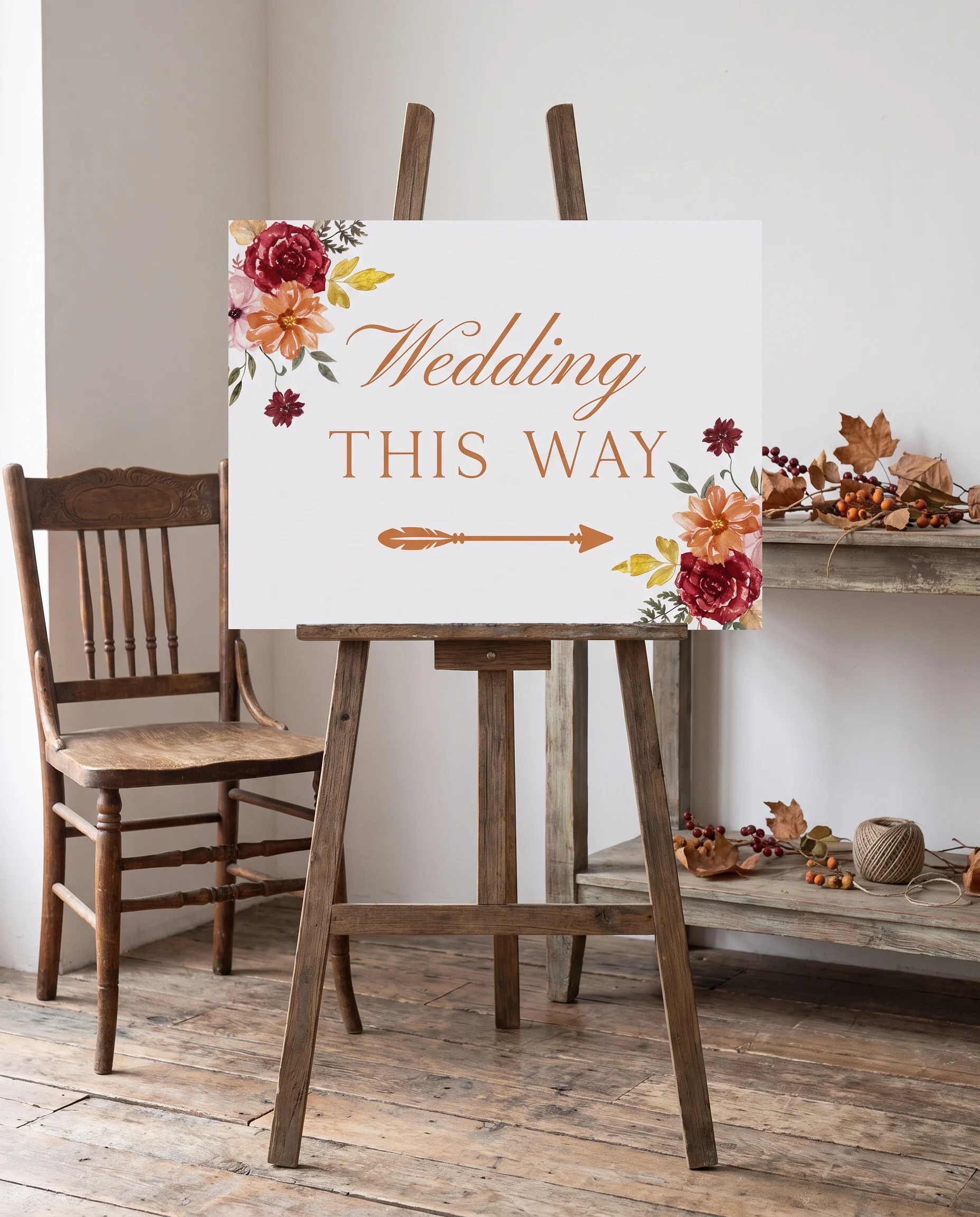 Ember Bloom wedding directional sign — shown beside furniture for scale under soft natural light, printable wedding signs.