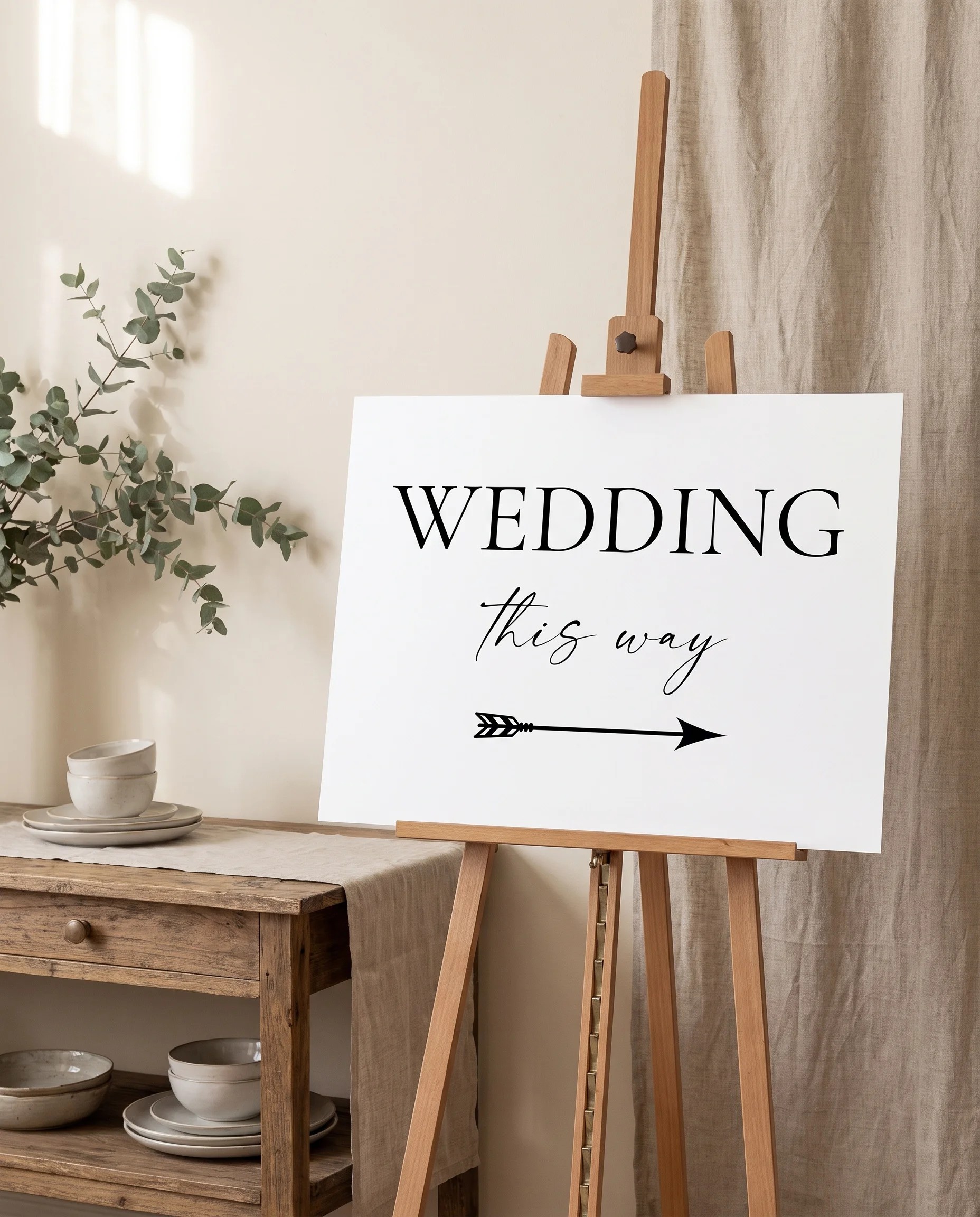 Arcadia wedding directional sign — shown beside furniture for scale on premium paper under soft natural light, printable wedding signs.
