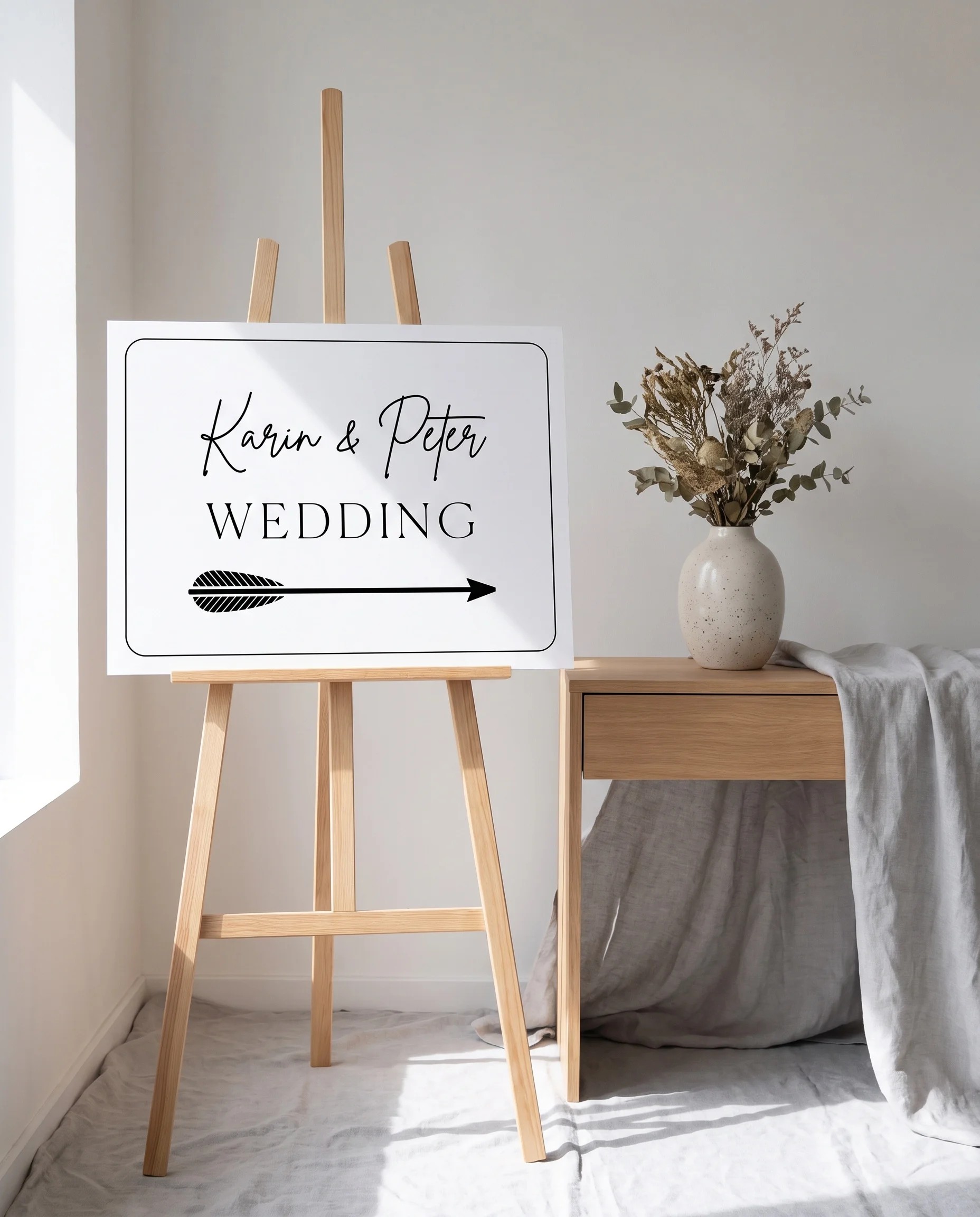 Contour wedding directional sign — shown beside furniture for scale on premium editorial paper under soft natural light with a slight overhead angle, printable wedding signs.