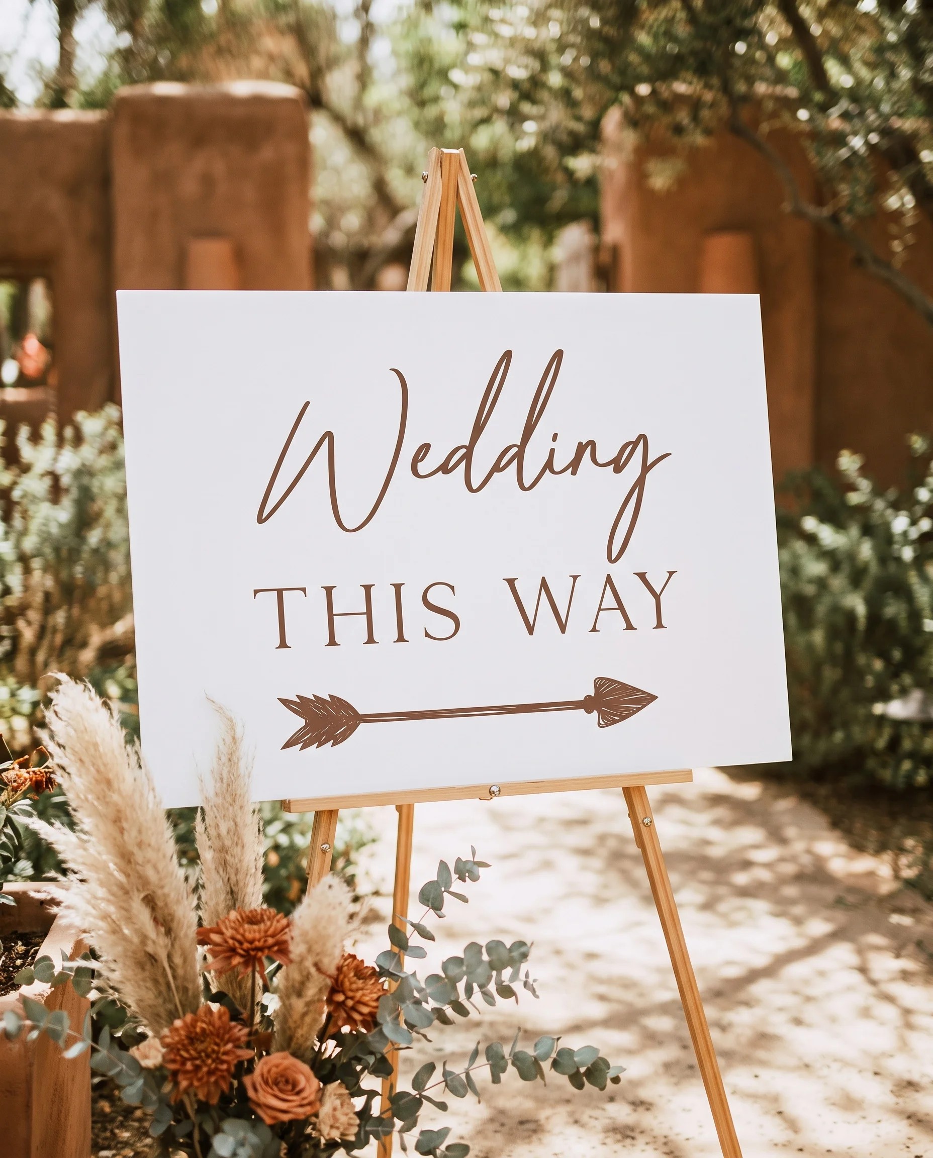 Briar Script wedding directional sign — displayed in a wedding venue setting under soft natural light, premium wedding signage.