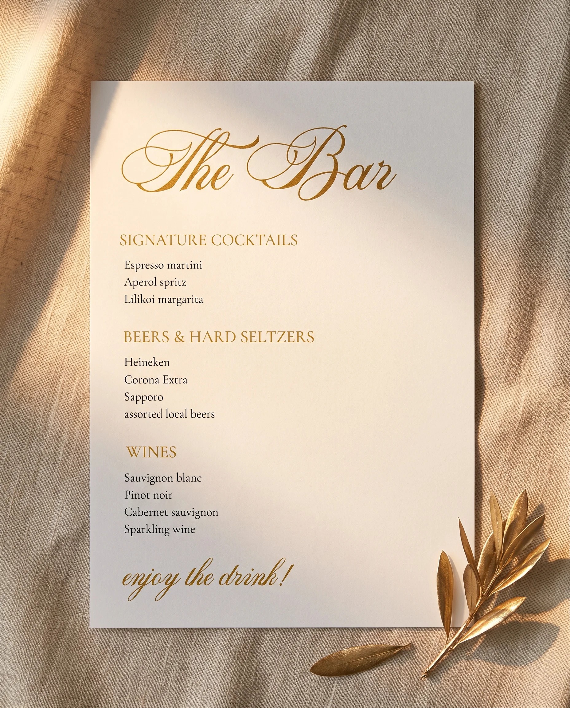 Gilded Arrow — flat lay of the bar menu on premium editorial paper under soft natural light, wedding bar menu.