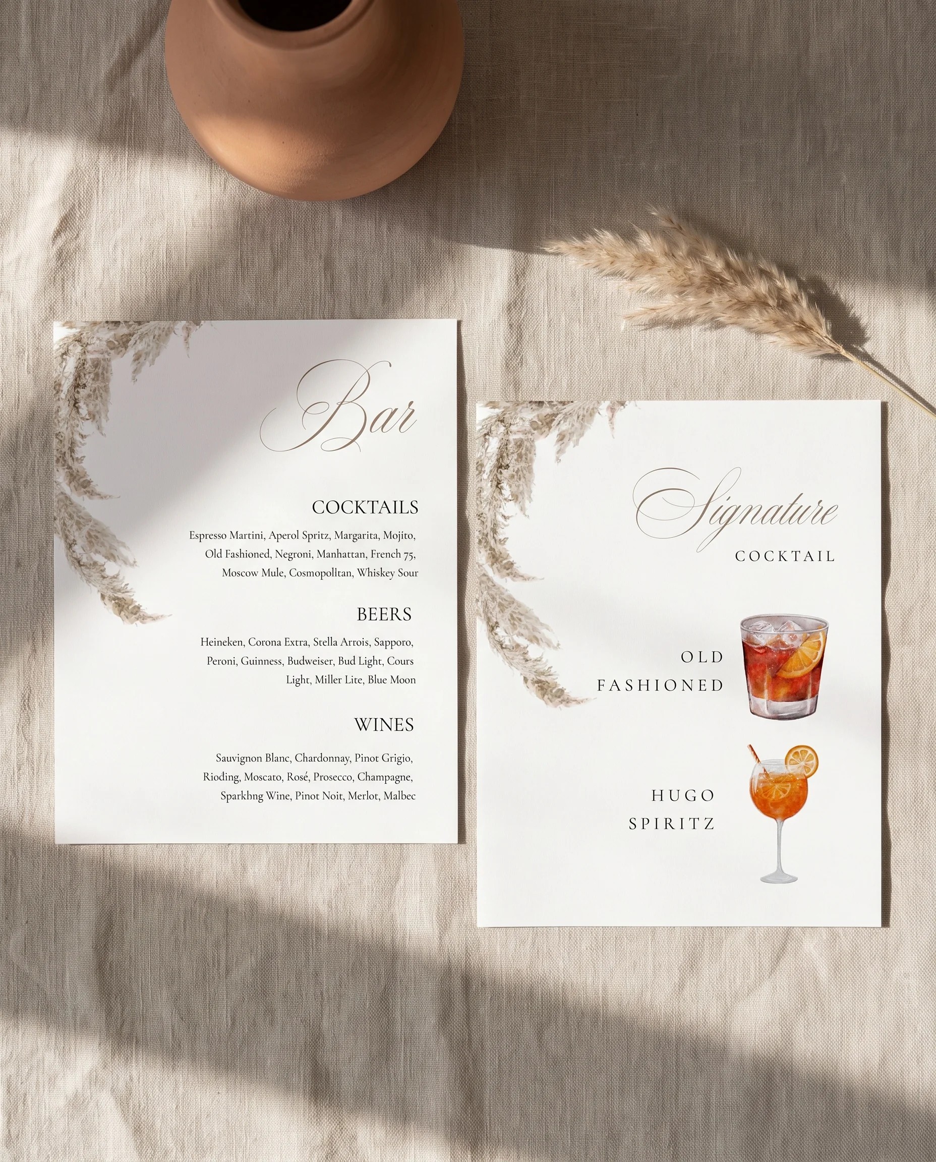 Pampas — flat lay of both bar menu pages on premium editorial paper under soft natural light, wedding bar menu.