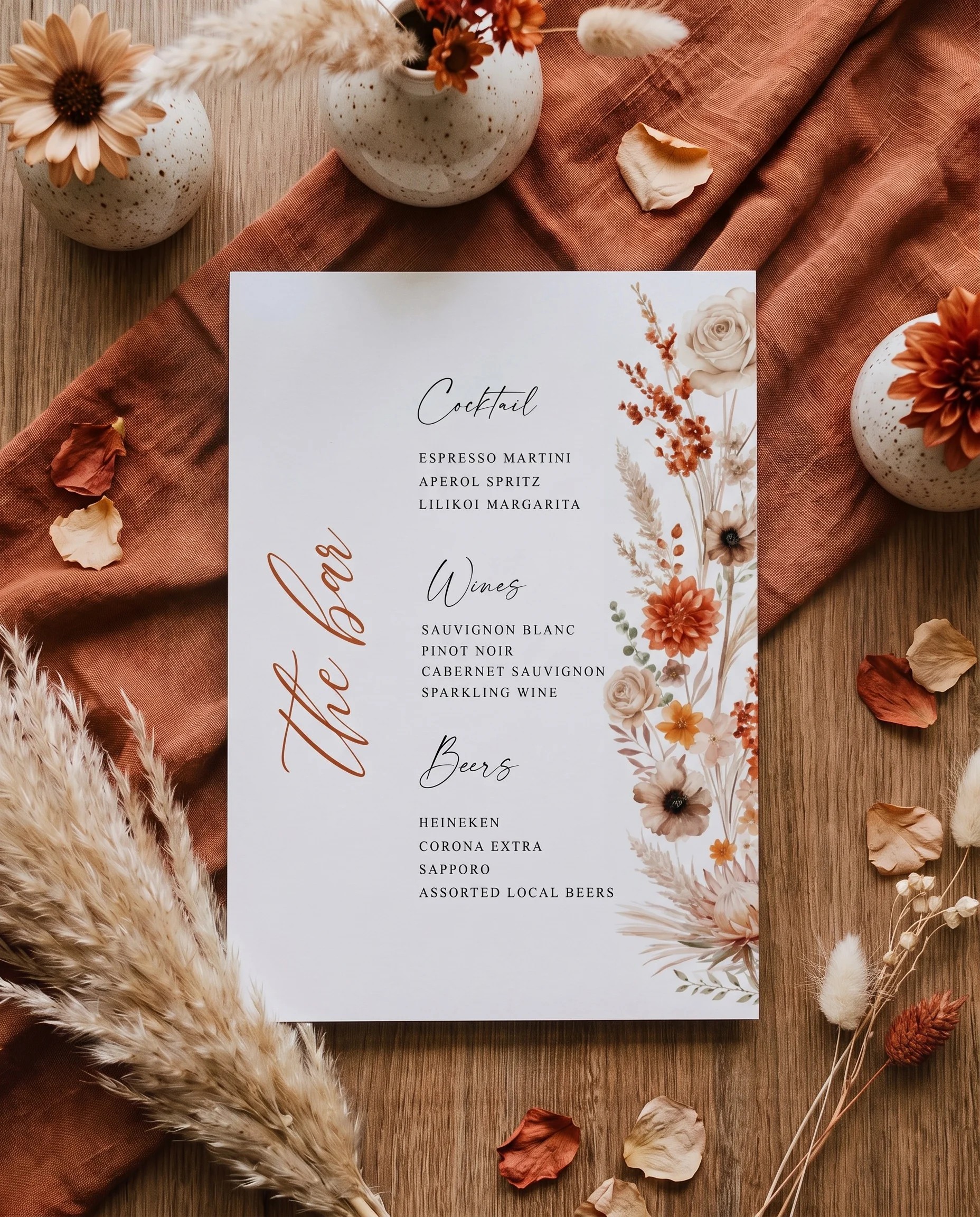 Dahlia Ember — bar menu page shown flat under soft natural light with a slight overhead angle, wedding bar menu.