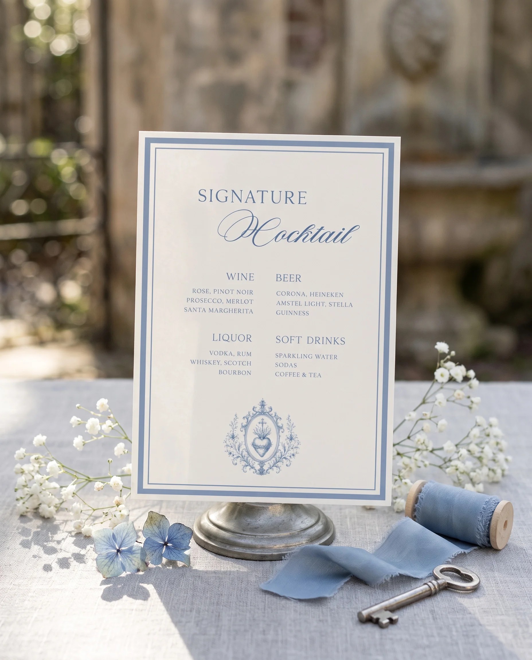 Azure Flourish — bar menu displayed upright in a styled setting under soft natural light, shown at a slight overhead angle, wedding bar sign.