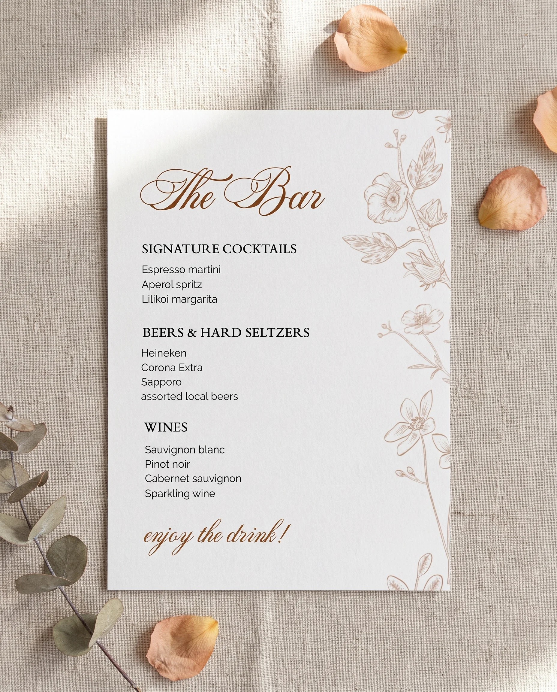Petalcrest — full bar menu page shown flat under soft natural light with a slight overhead angle, wedding bar menu.