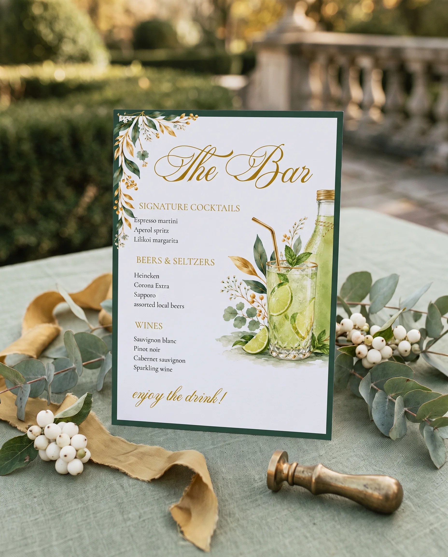 Gilded Foliage — bar menu displayed upright in a styled setting, shot at a slight overhead angle in soft natural light, wedding bar sign.