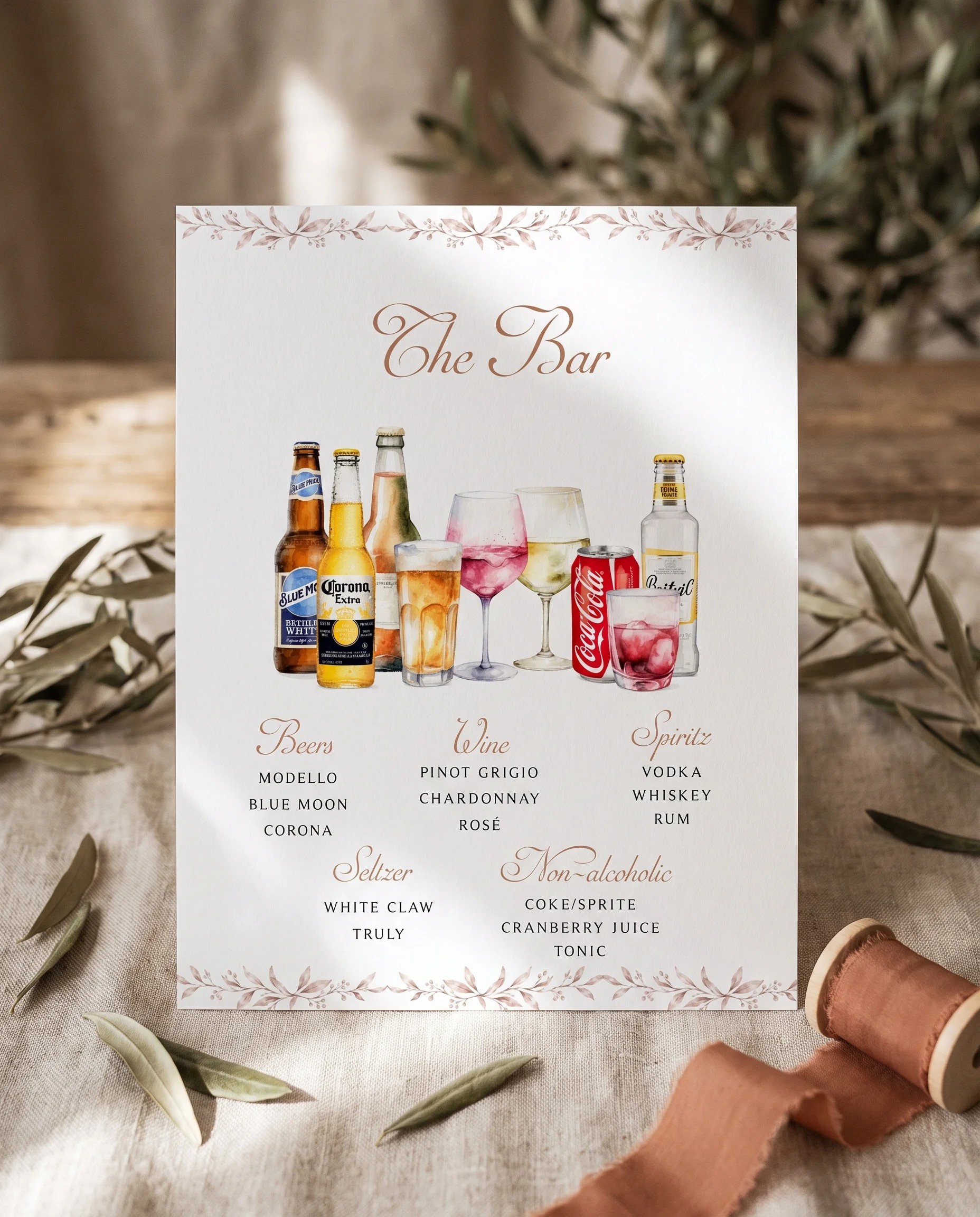 Sepia Sprig — bar menu page displayed upright in a styled setting under soft natural light, wedding bar sign