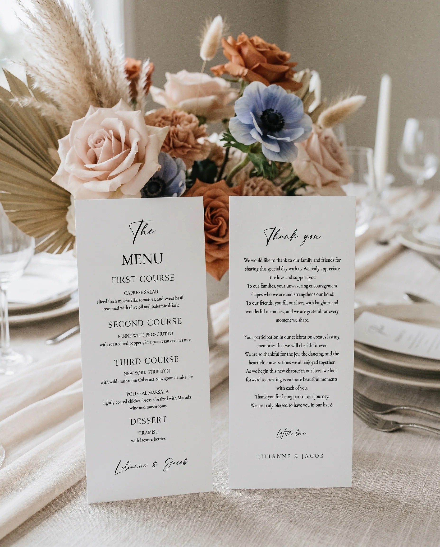 Tonal Reply wedding menu — two pages standing upright on a reception table under soft natural light, wedding menu template.