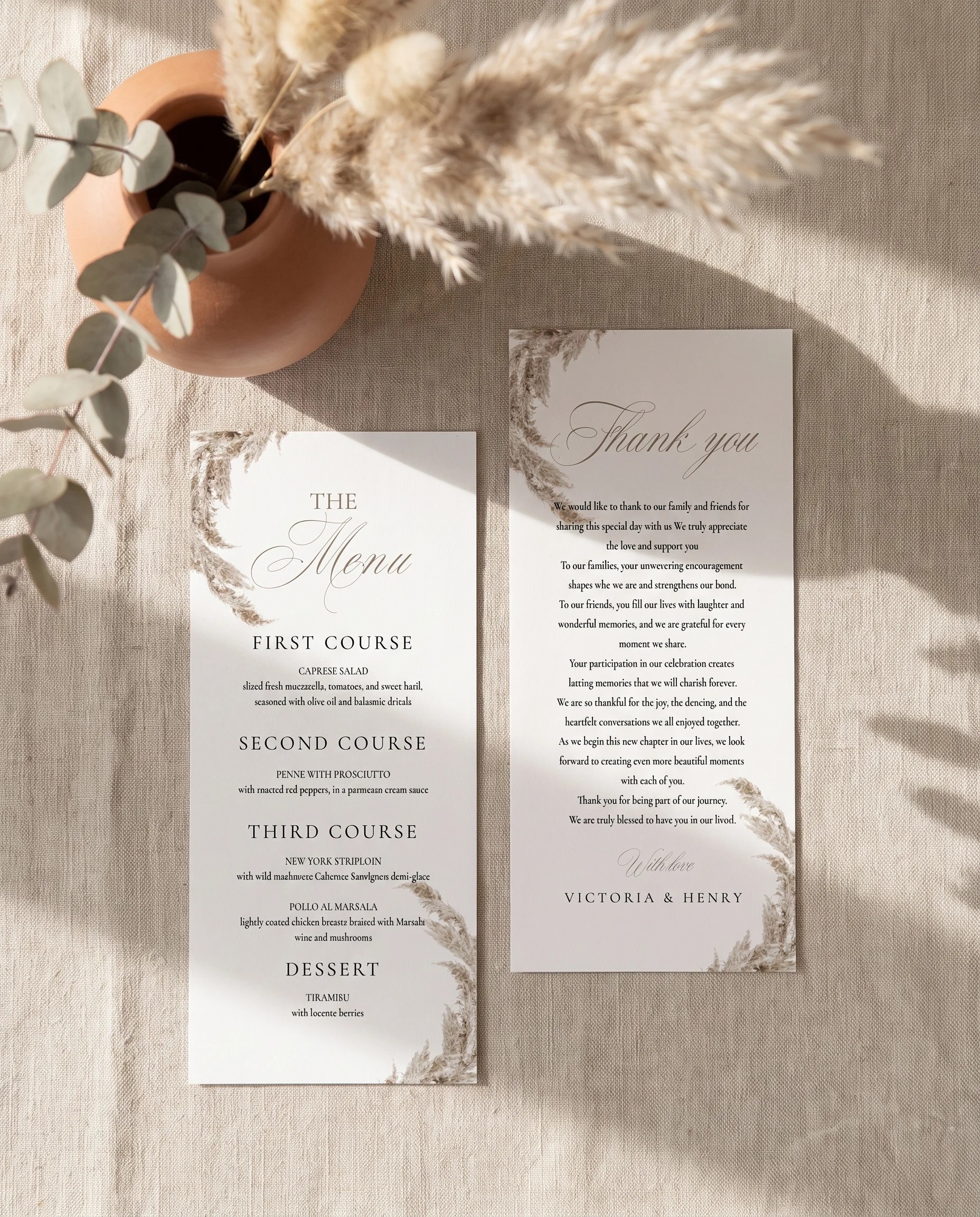 Pampas wedding menu — two menu pages shown flat under soft natural light at a slight overhead angle, wedding menu.
