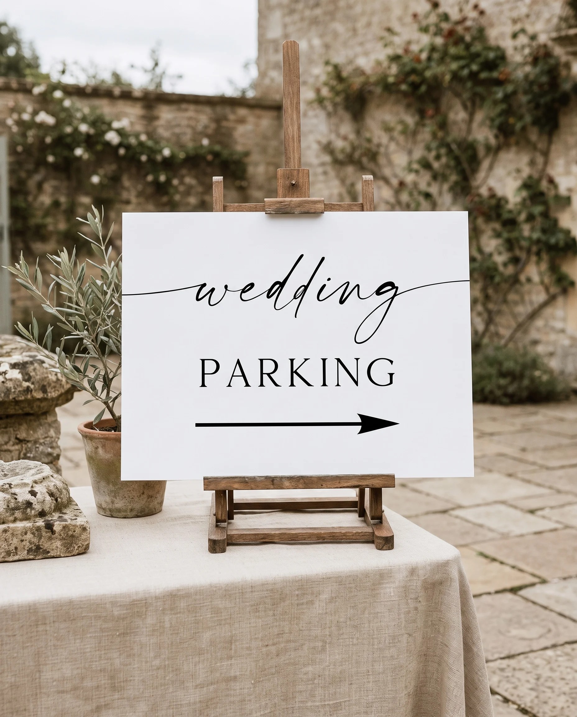 Liminal wedding parking sign — displayed on an easel under soft natural light at a slight overhead angle, wedding parking signs.