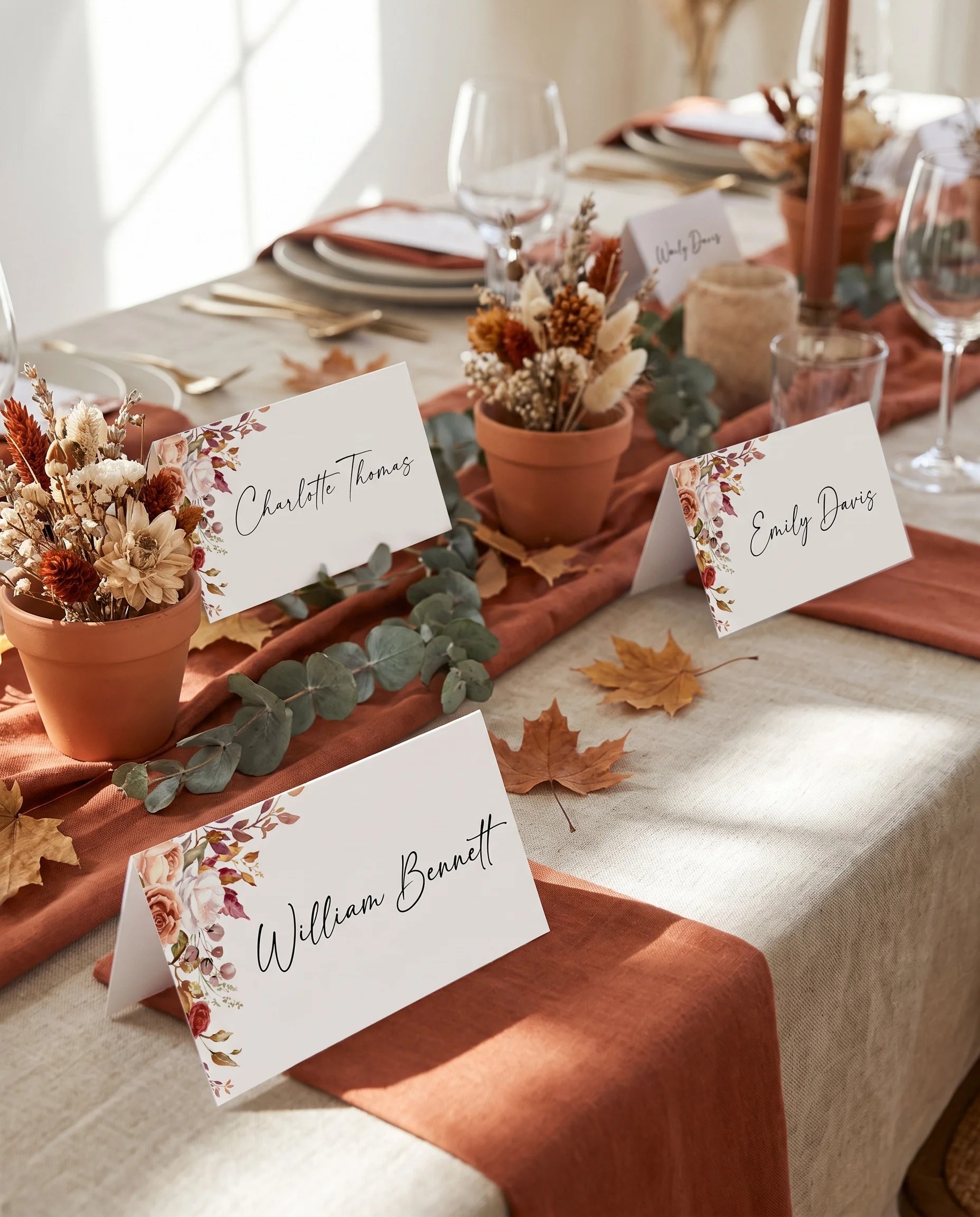 Autumn Bloom wedding place cards — several place cards arranged on a dressed reception table under soft natural light, place card template.