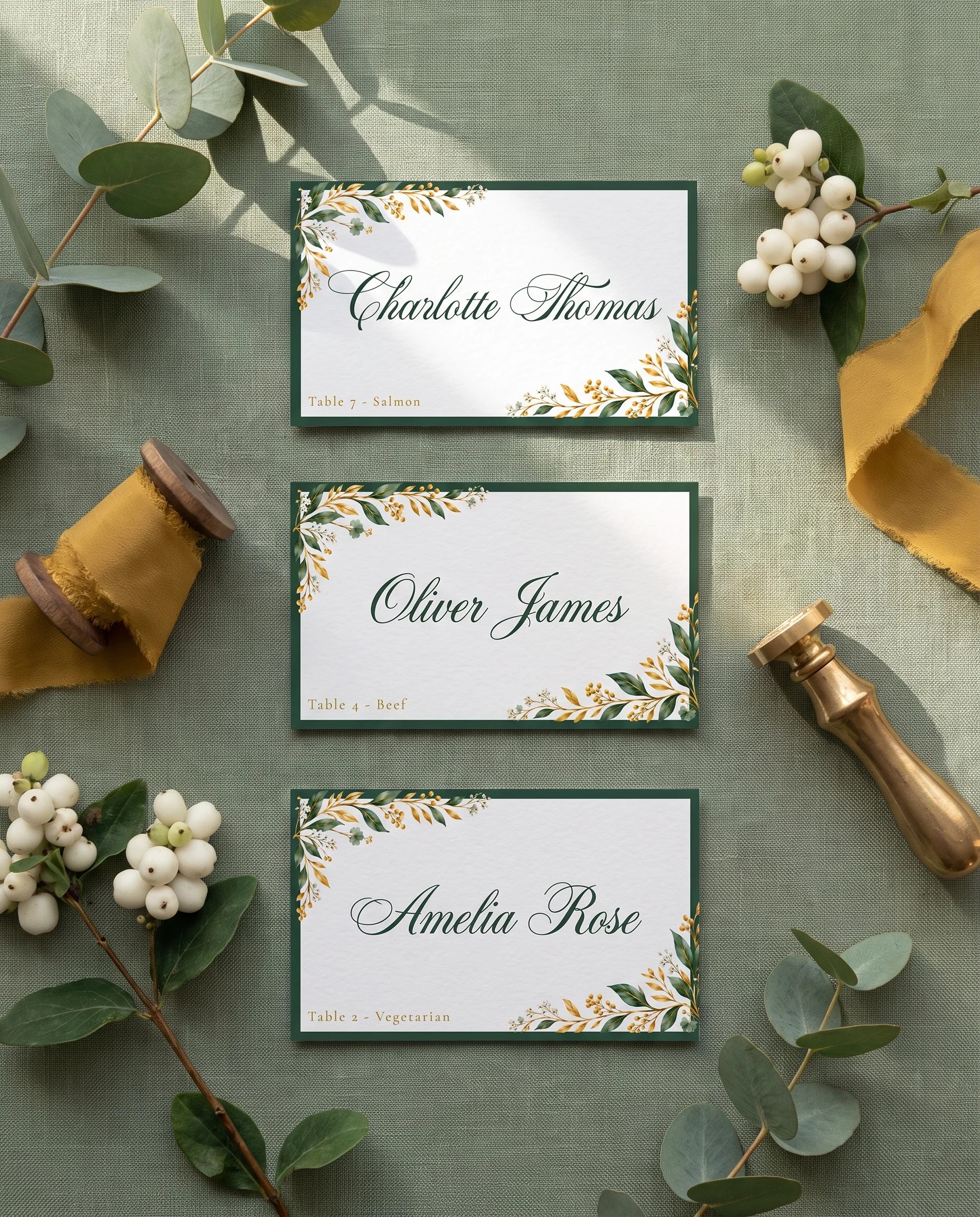 Gilded Foliage wedding place cards — several place cards shown flat under soft natural light, overhead angle, wedding place cards