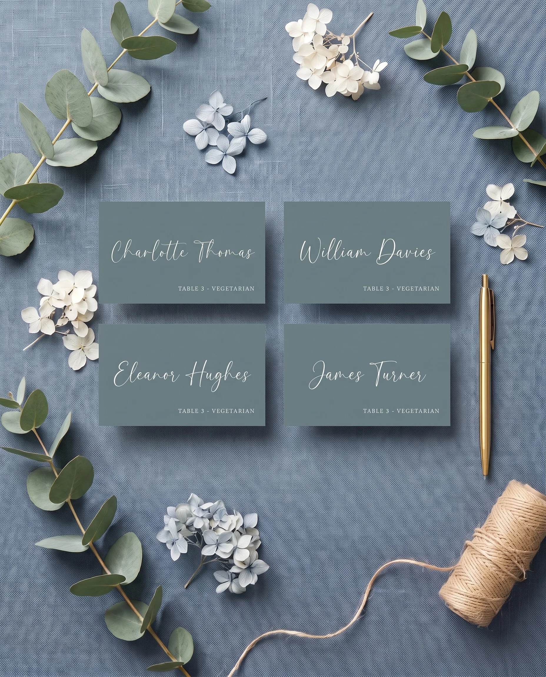 Arrow Crest wedding place cards — several place cards shown flat in an overhead editorial flat lay, wedding place cards.