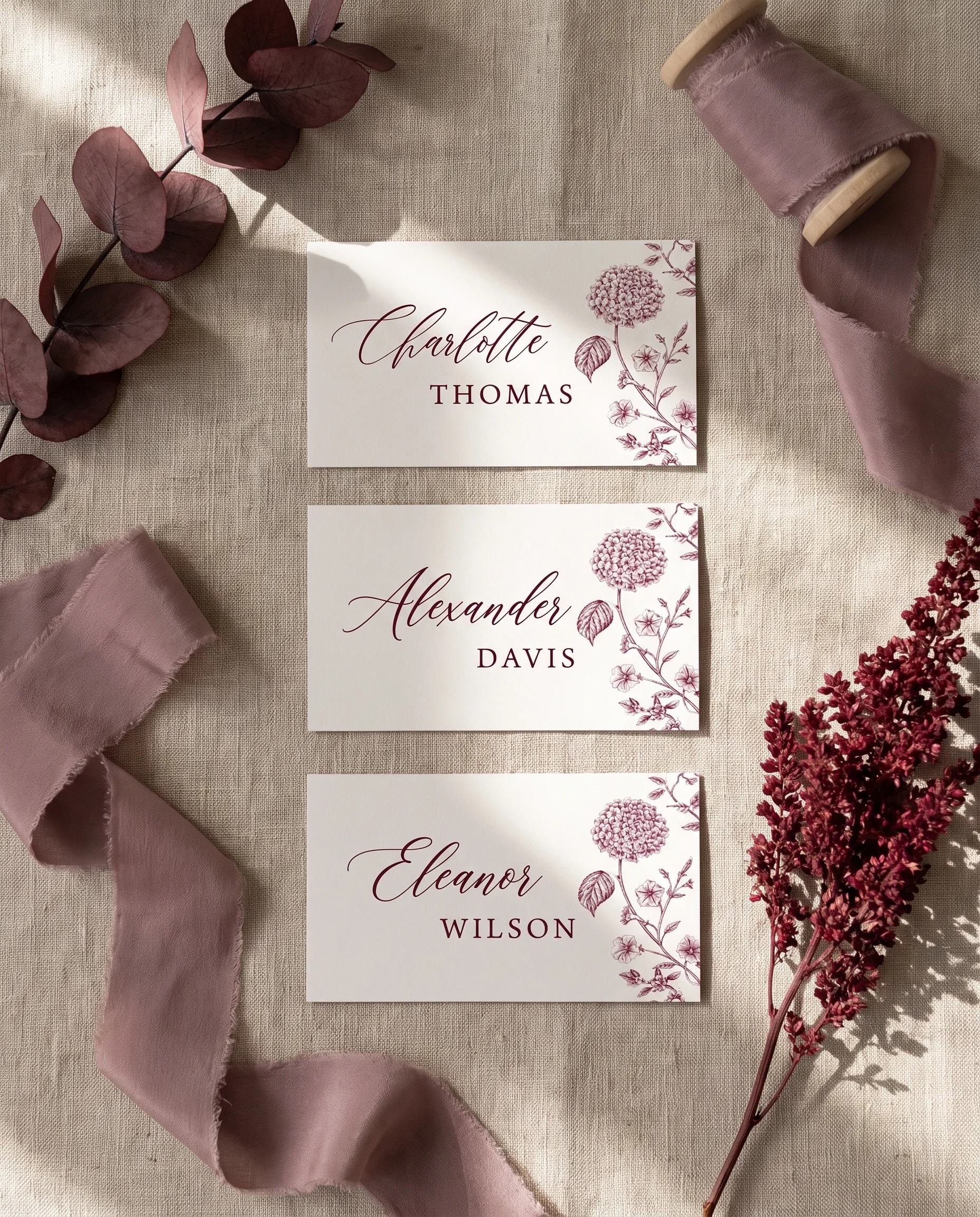 Chantilly wedding place cards — several place cards shown flat under soft natural light at a slight overhead angle, wedding place cards