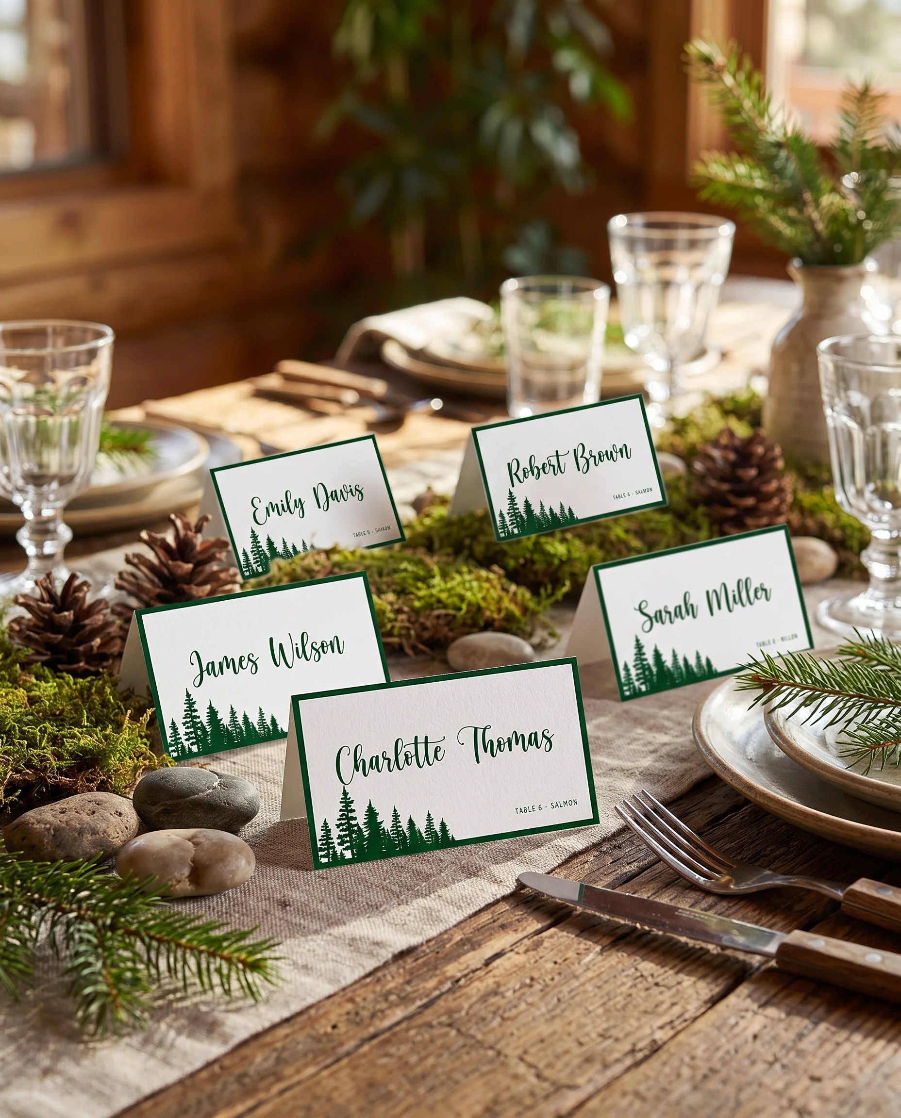 Evergreen Star wedding place cards — cards arranged on a dressed reception table under soft natural light, place card template