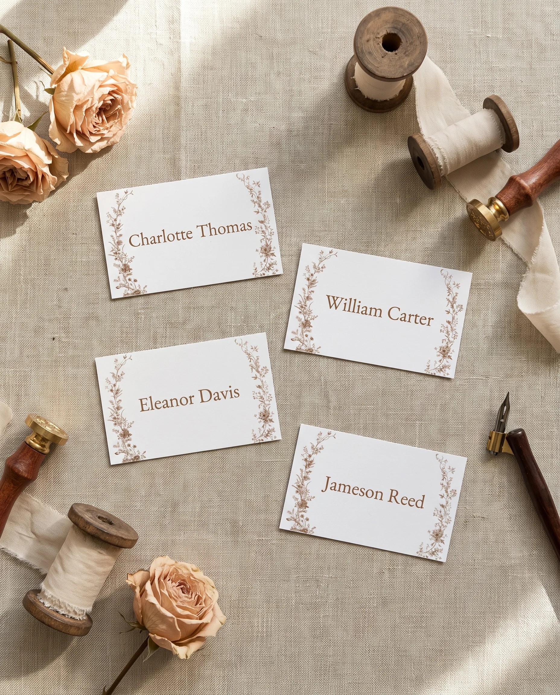 Sepia Crest wedding place cards — several place cards shown flat under soft natural light, wedding place cards
