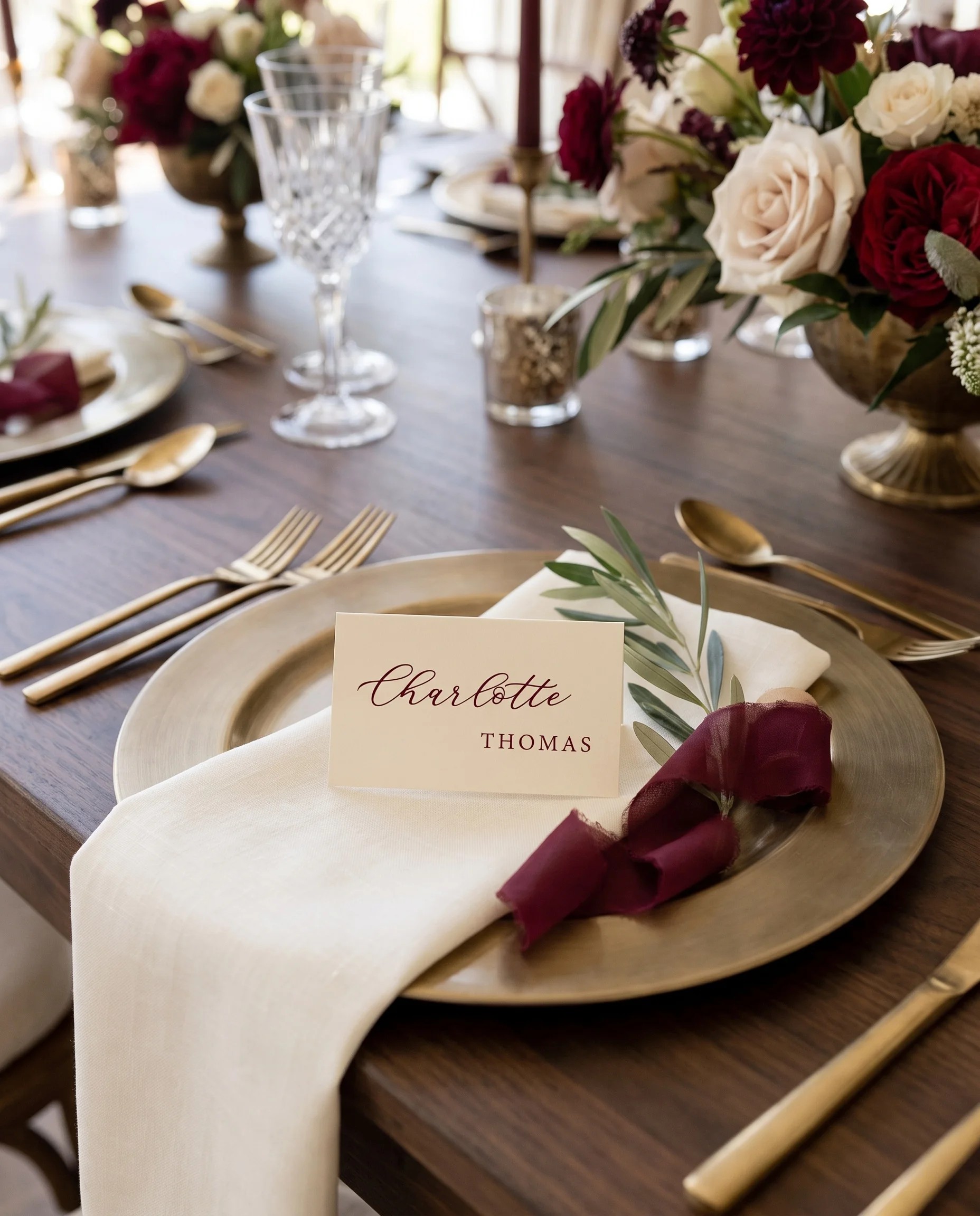 Claret Vine wedding place cards — a single card displayed at a set place setting under soft natural light, wedding name cards.