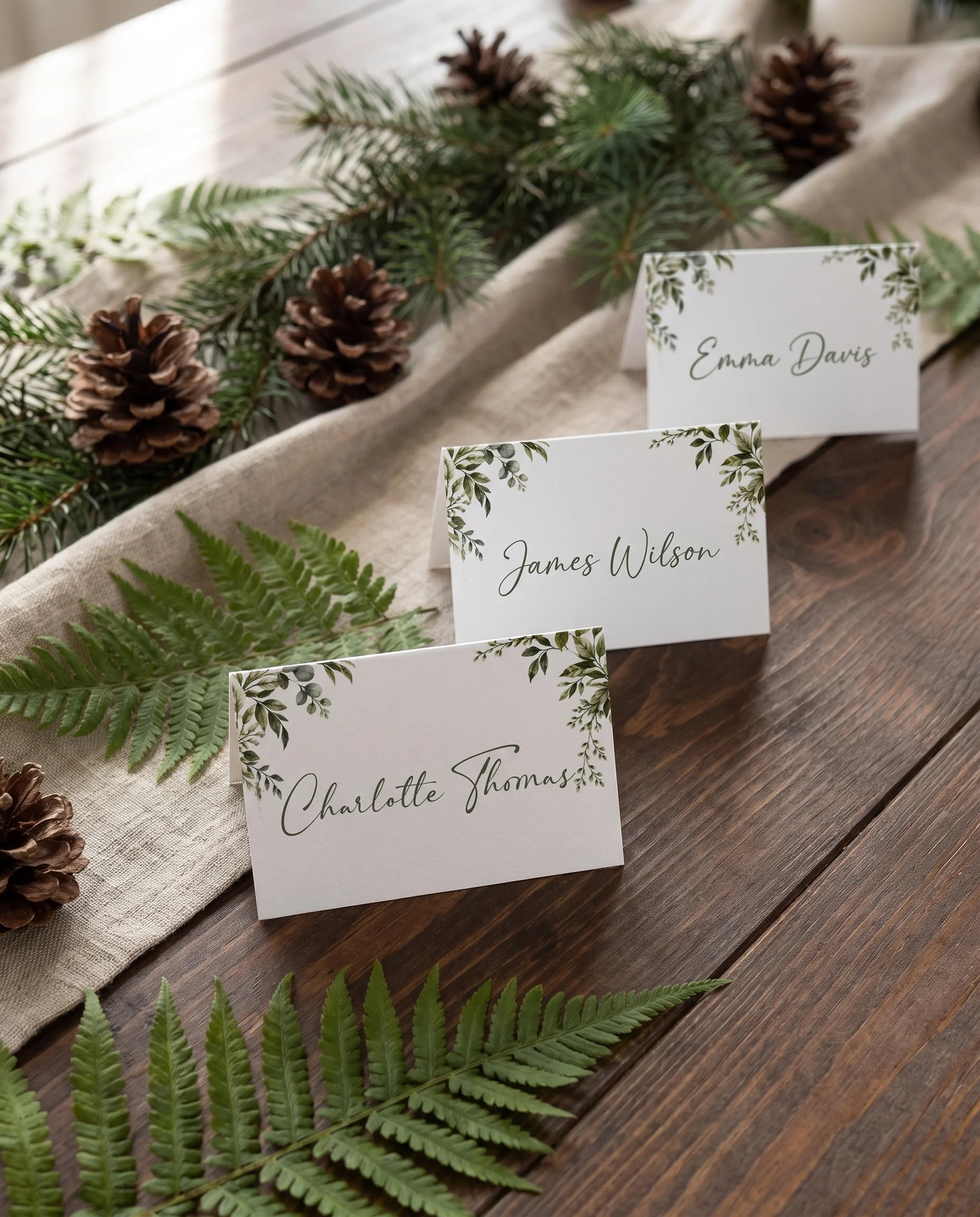 Canopy Grove wedding place cards — several cards arranged on a dressed reception table under soft natural light, place card template.