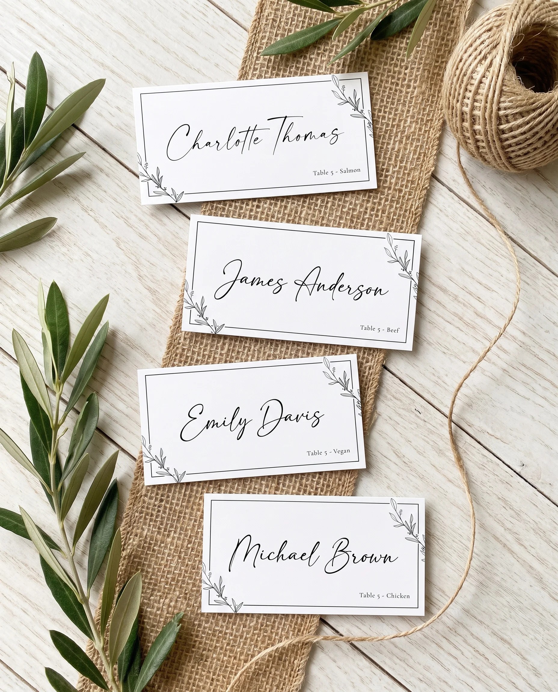 Willow Script wedding place cards — several place cards shown flat under soft natural light on premium editorial paper, wedding place cards.