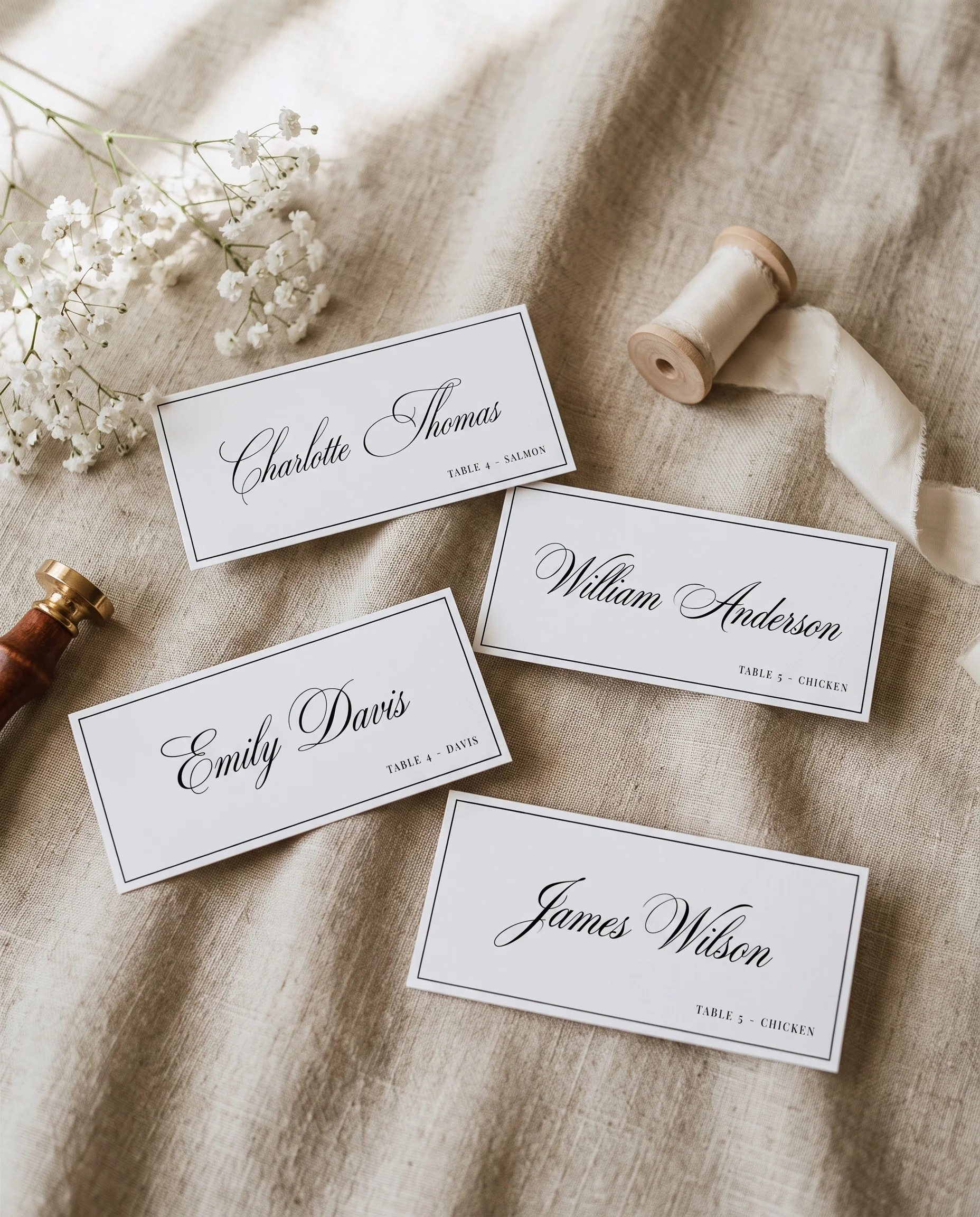 Crestline wedding place cards — several place cards shown flat under soft natural light at a slight overhead angle, wedding place cards.